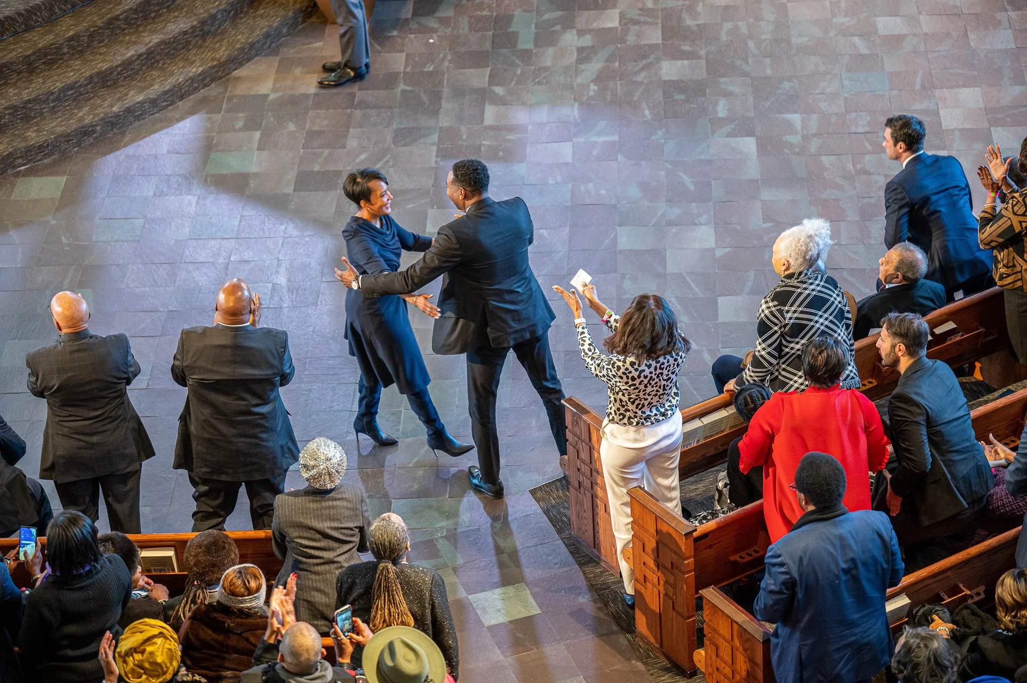 Former Atlanta Mayor and United States President Joe Biden advisor Keisha Lance Bottoms is greeted by current Atlanta Mayor Andre Dickens, during a King Day celebration at Ebenezer Baptist Church in Atlanta.