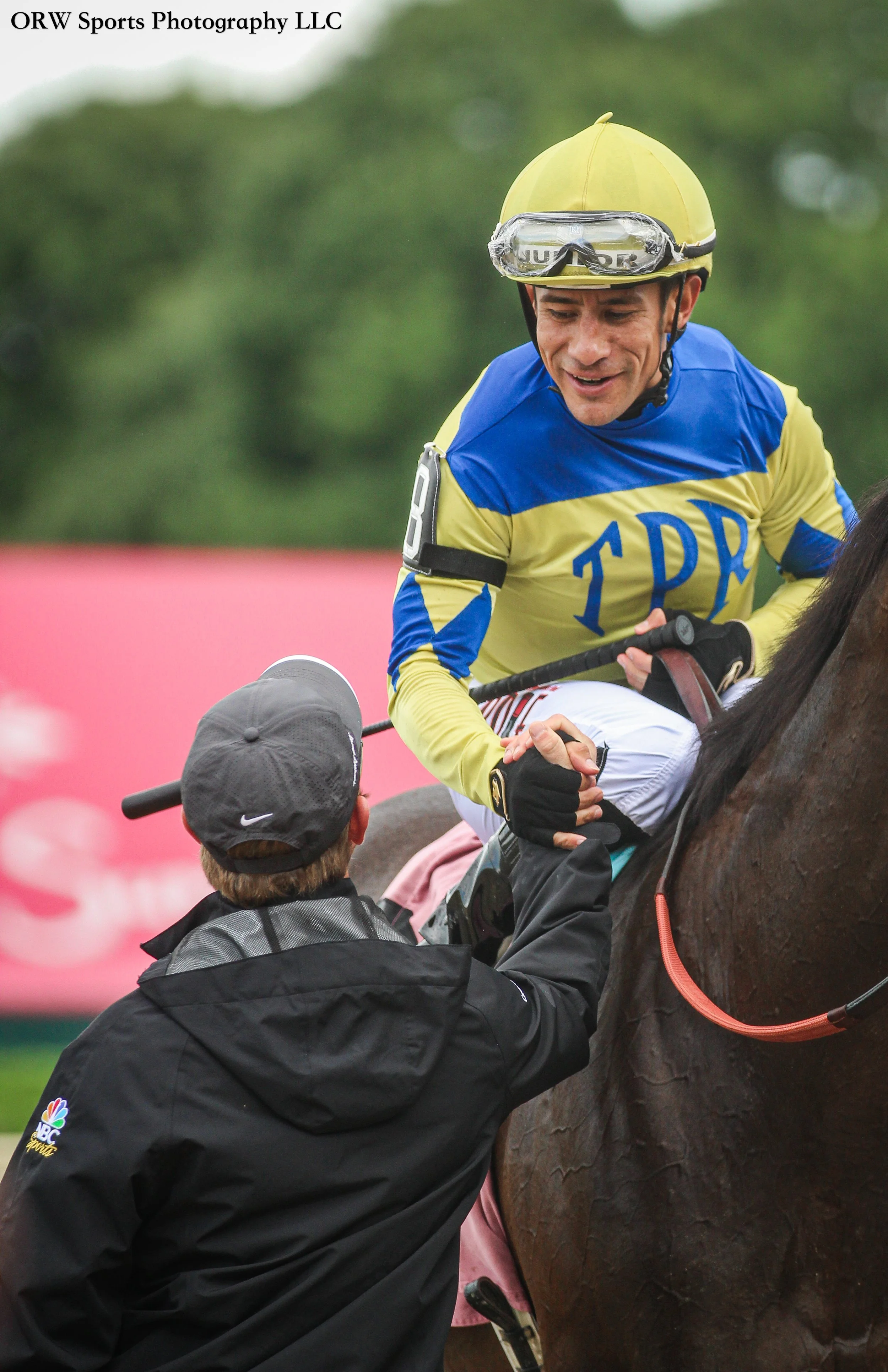 Junior Alvarado shakes hands with trainer Riley Mott after a winning debut with Fullcup 