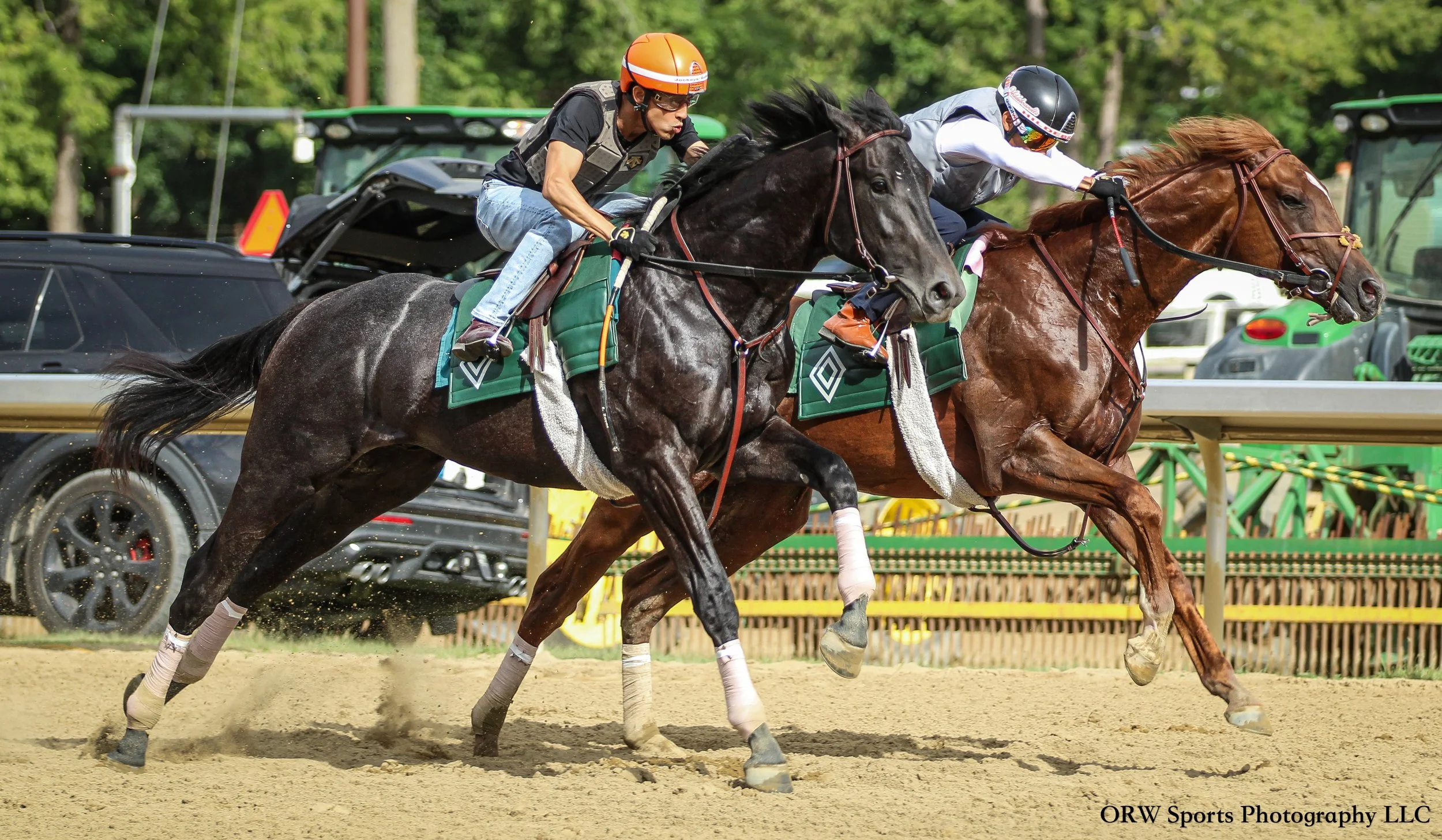 Edgard Zayas and Manny Franco breezing from the gate aboard Rily Mott trainees