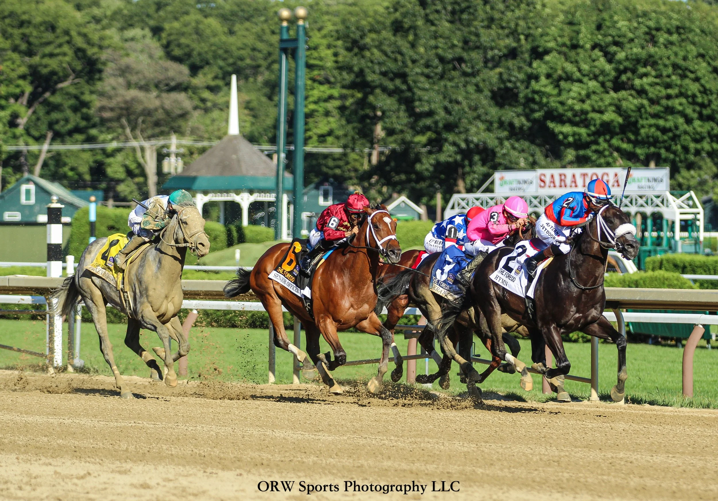 The Grade1 Forego Stakes. Hymn leads from the competition, while a battle for the minor placings unfolds. 
