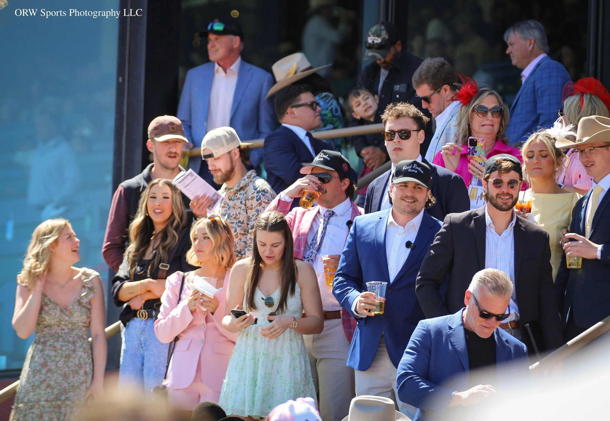 Team First Rodeo Racing has taken its spot on the steps! CEO Matt Scull is seen in the backwards hat and sunglasses, and co-owner Brian Mills is to his left. Friends of the team, including Tanner Reisman (in the cowboy hat) of the Next-Gen Throughbre