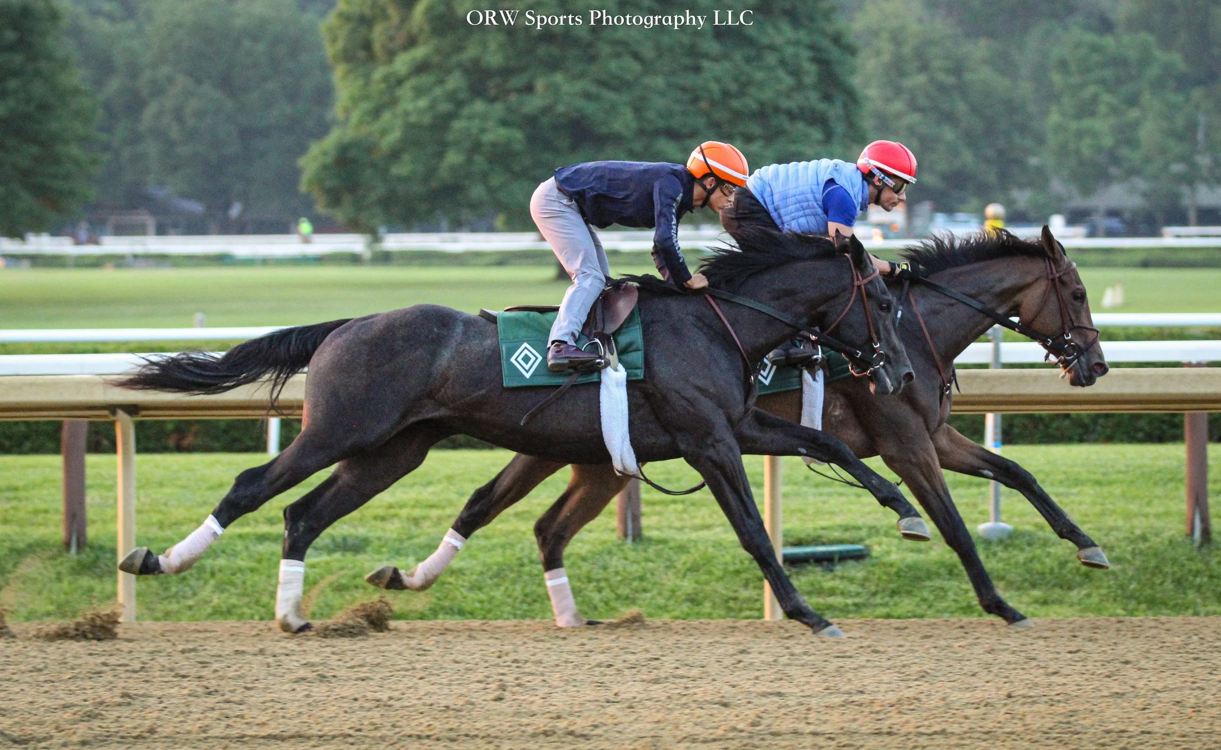 Jockeys Junior Alvarado (red) and Edgard Zayas (orange) aboard for Riley Mott 