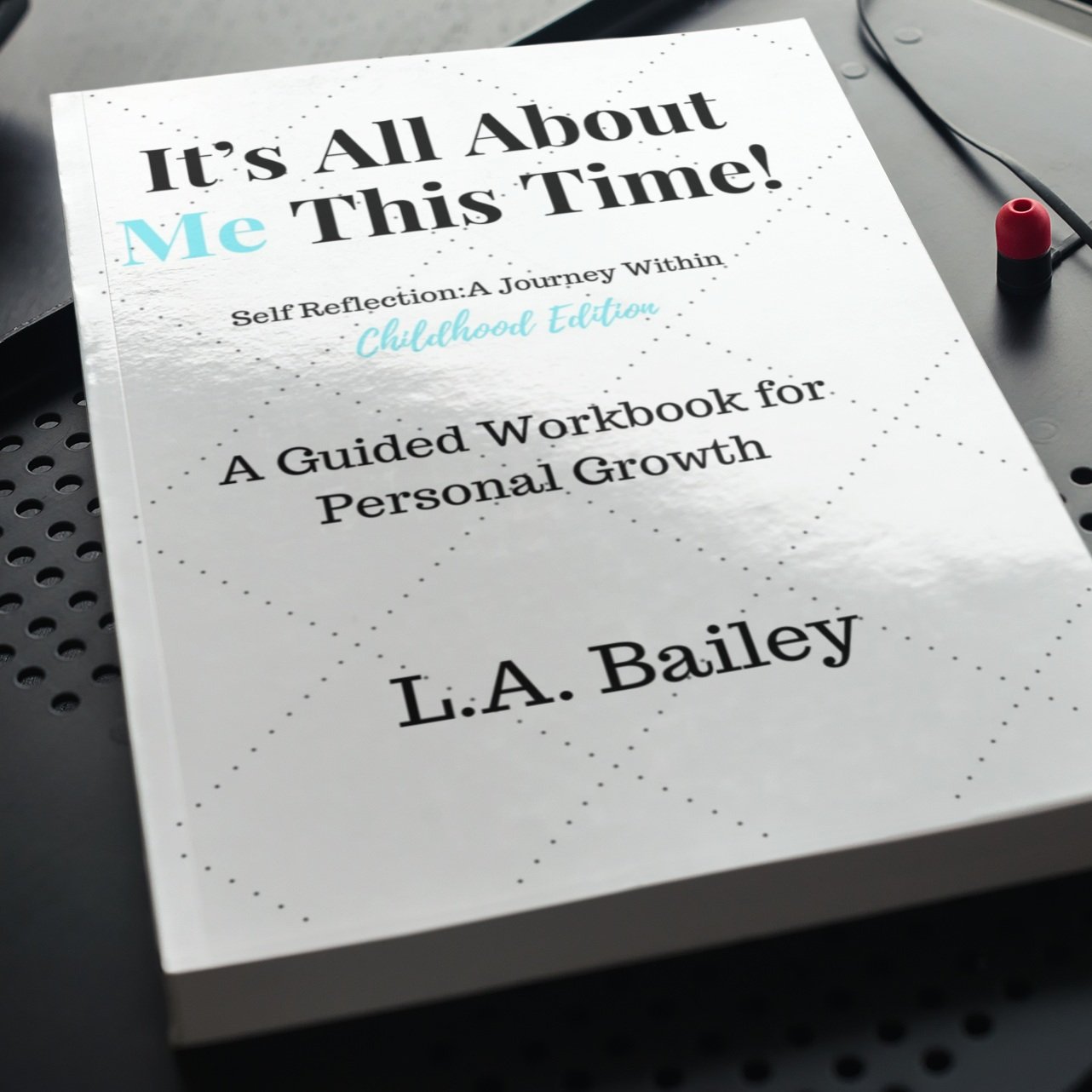 IAAMTT+-+LB+book-on-a-dark-color-metal-surface-.jpg