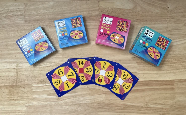 Math 24 game boxes and cards fanned out on a table
