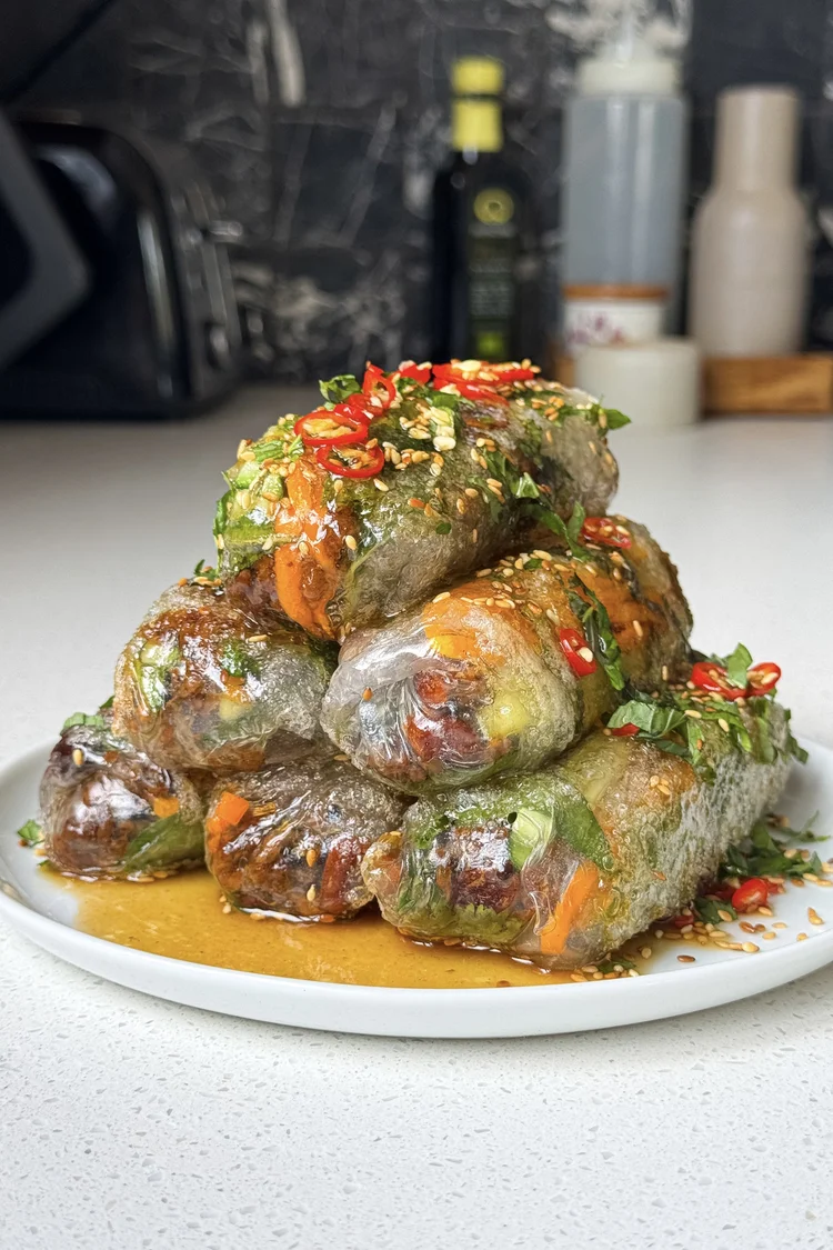 Cold halal beef rice paper rolls with fresh herbs and peanut sauce for light summer lunch