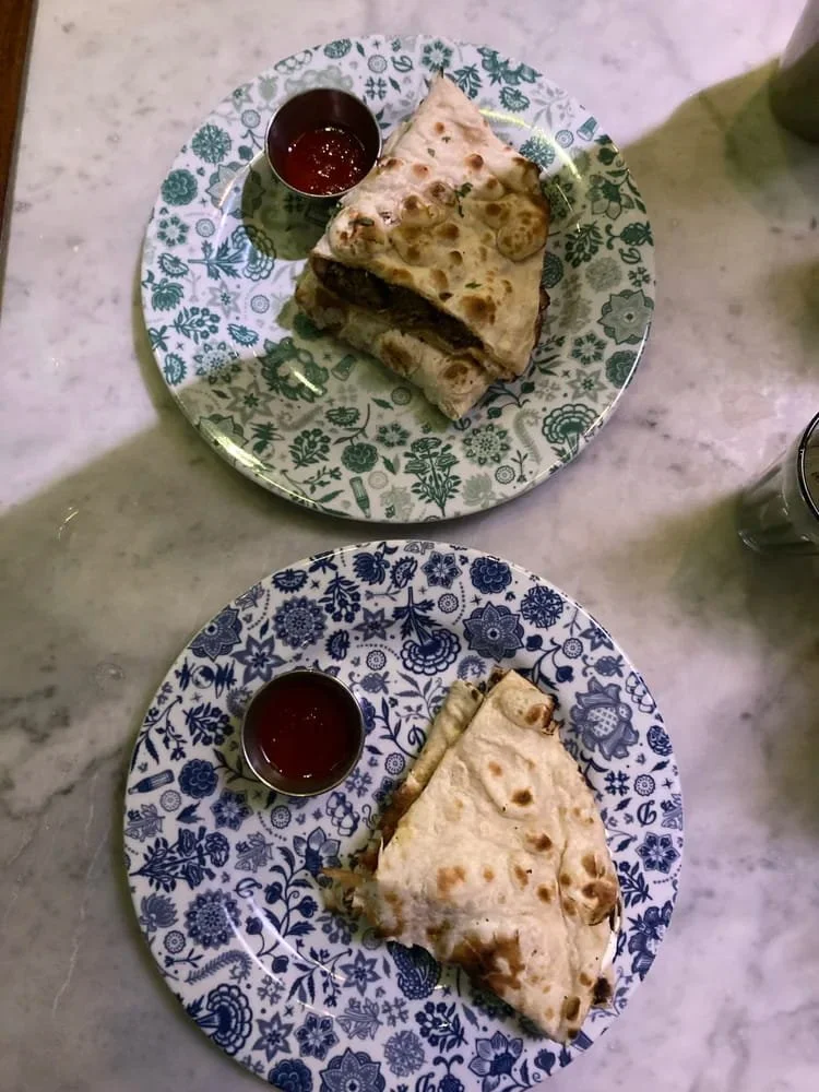 Two plates of food with different plates