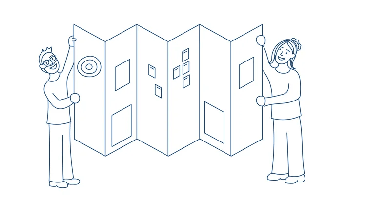 Two smiling people holding up an oversized roadmap