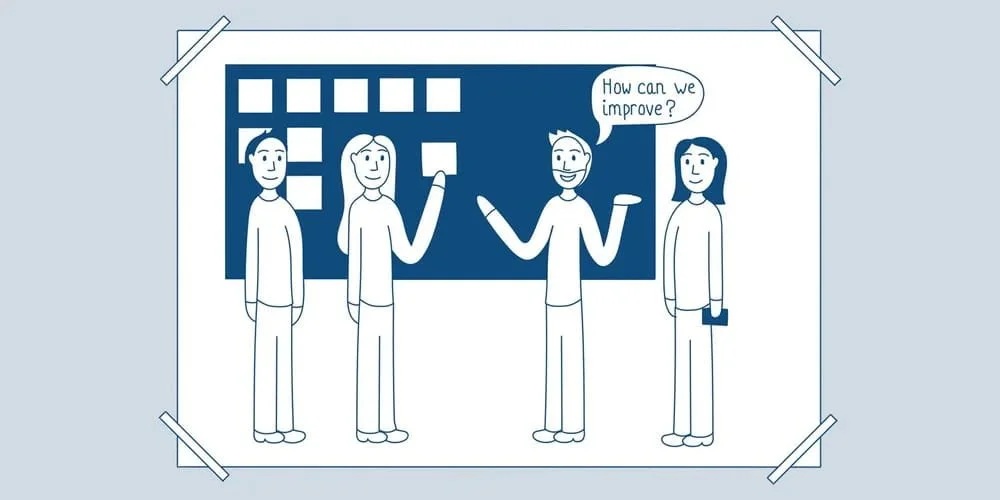 A group of people smiling around a value stream map