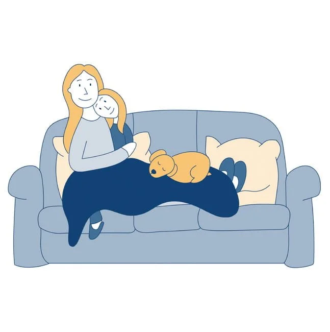 A woman, child and dog curled up on a sofa