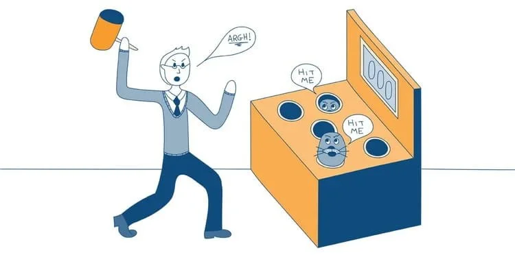 An angry man playing whack-a-mole