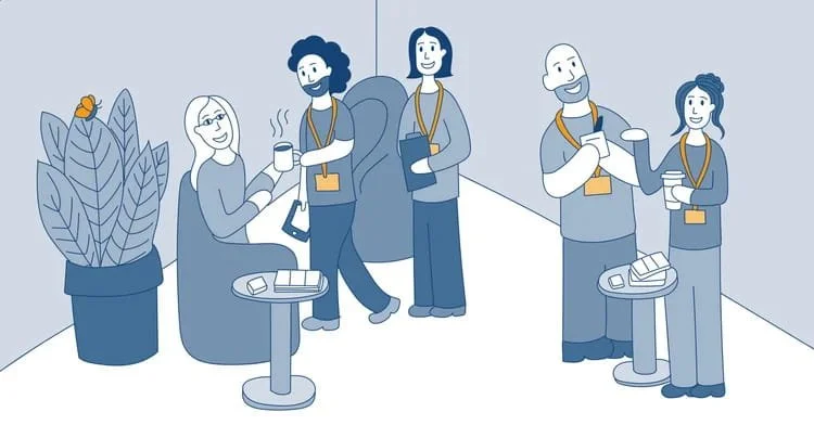 A group of people smiling in an office