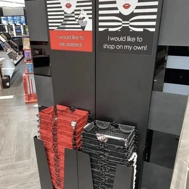 A pile of red baskets and black baskets