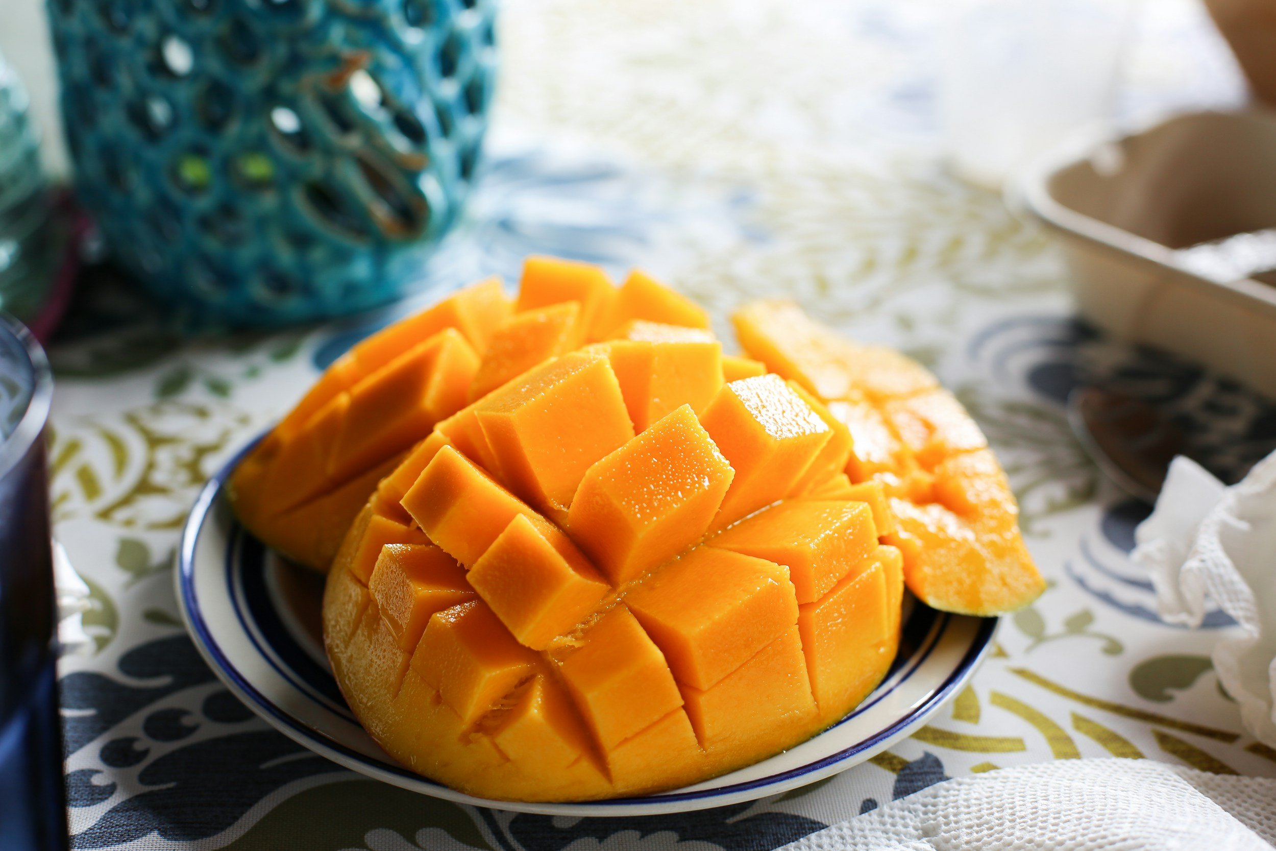 Freshly cut mango cubes on a plate