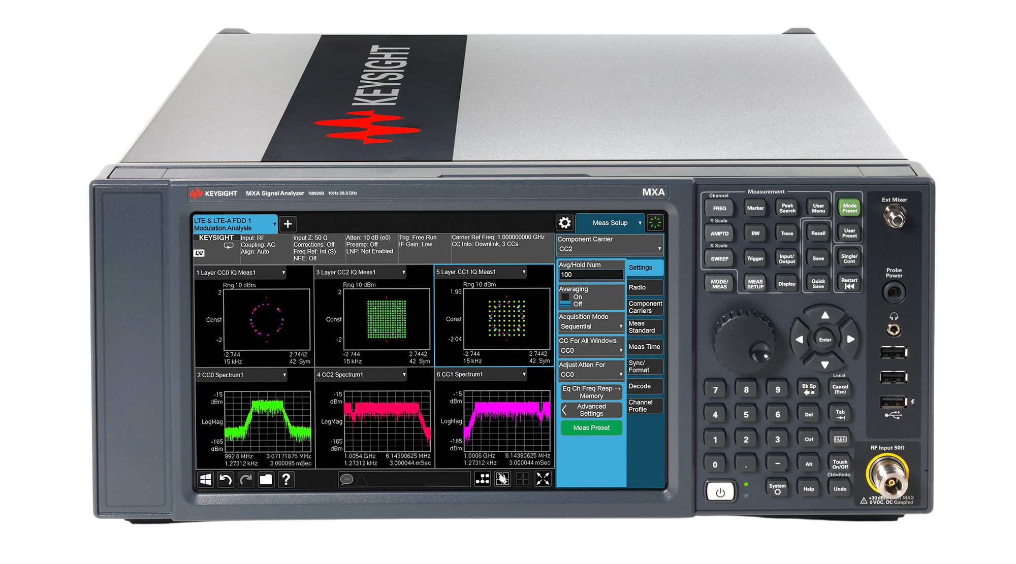 A Keysight MXA signal analyzer with a digital display showing frequency spectrum graphs and control buttons.