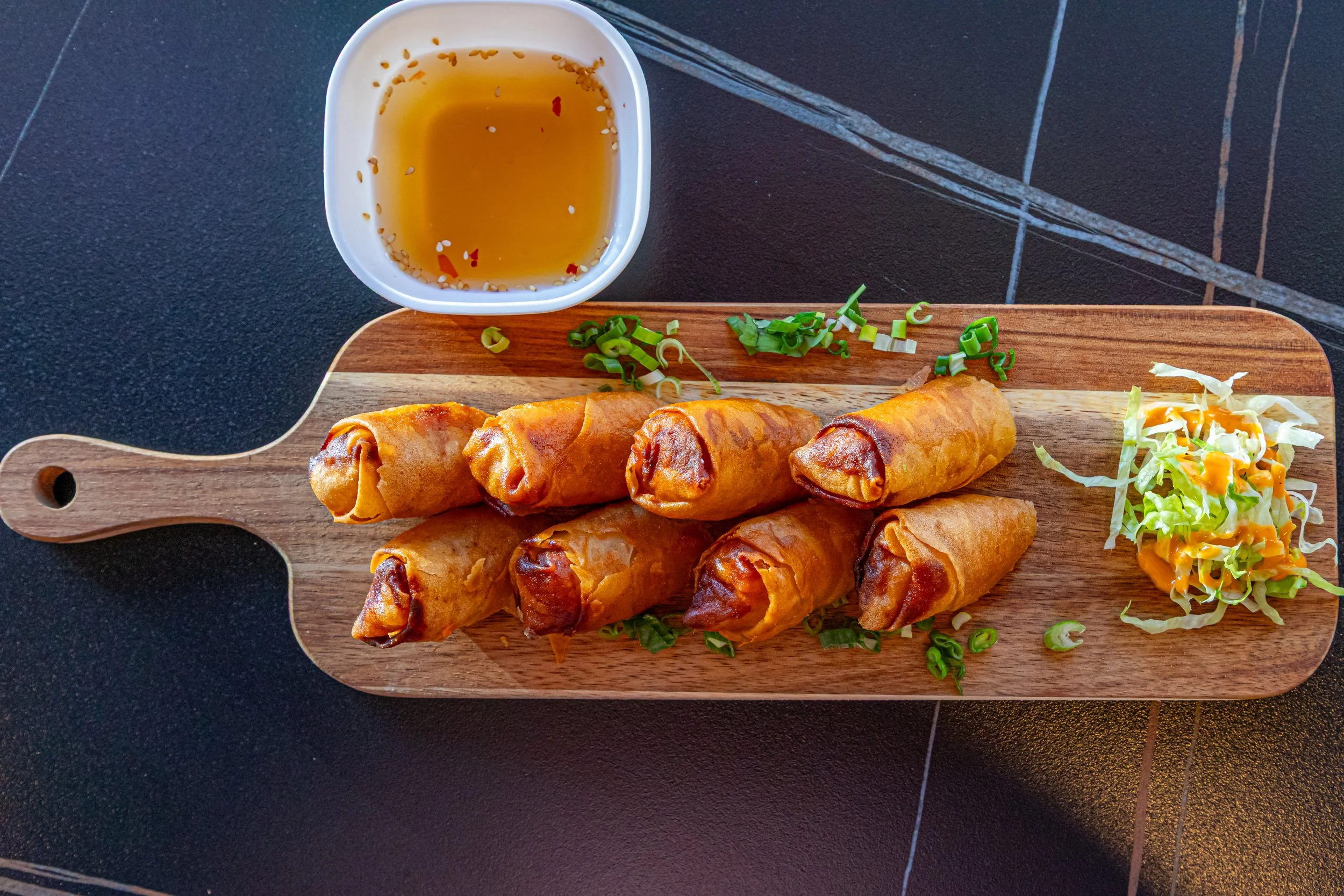 Spring Roll — housemade, deep-fried with chicken and vegetables