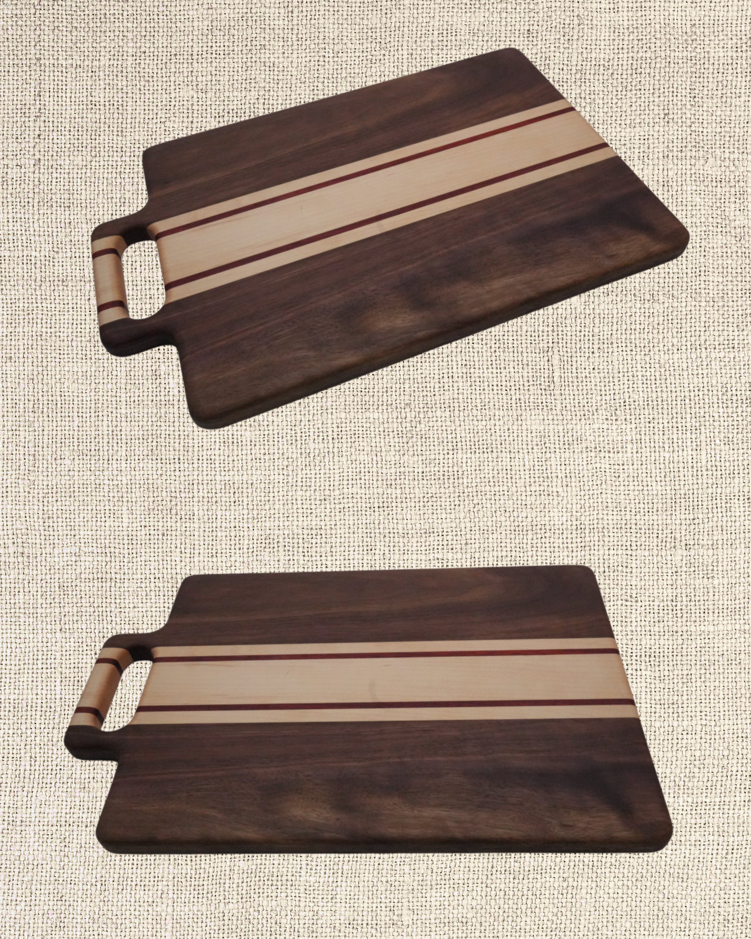 Two wooden cutting boards with a striped design on a textured beige surface.