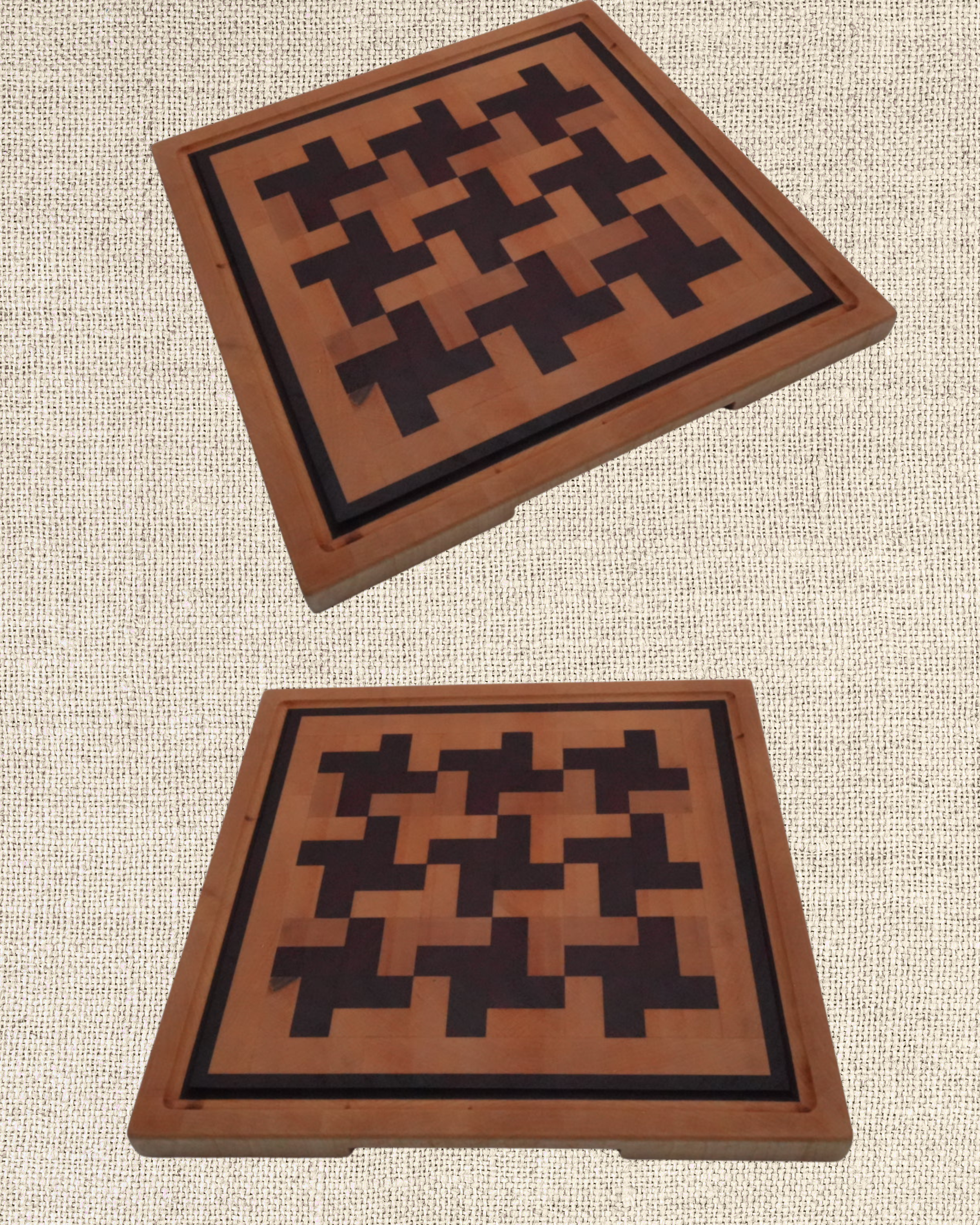 Two wooden chess or checkers boards with geometric patterns, seen from above against a textured background.