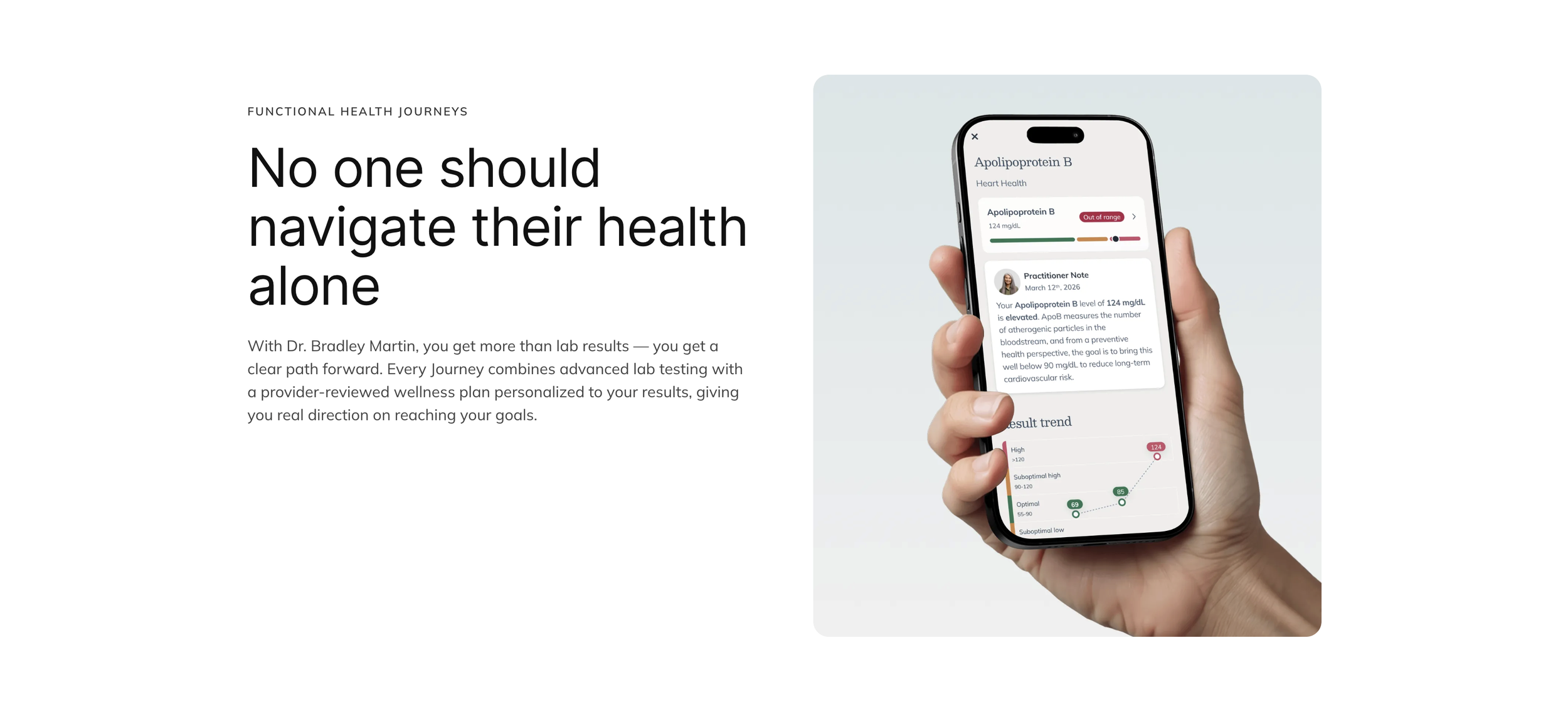 A hand holding a smartphone displaying a health tracking app with a chart and health data