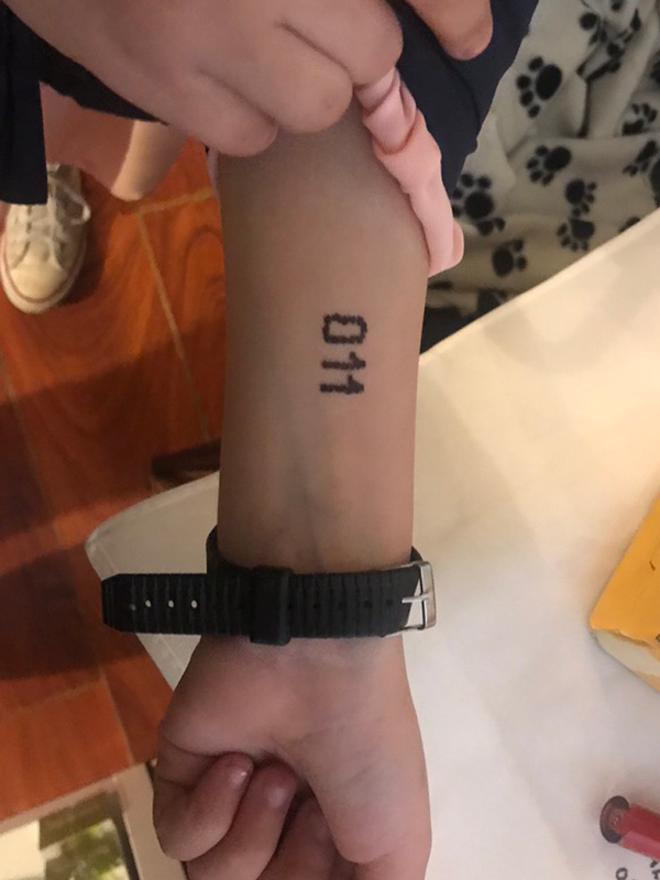  011 “tattoo” drawn with a permanent marker 