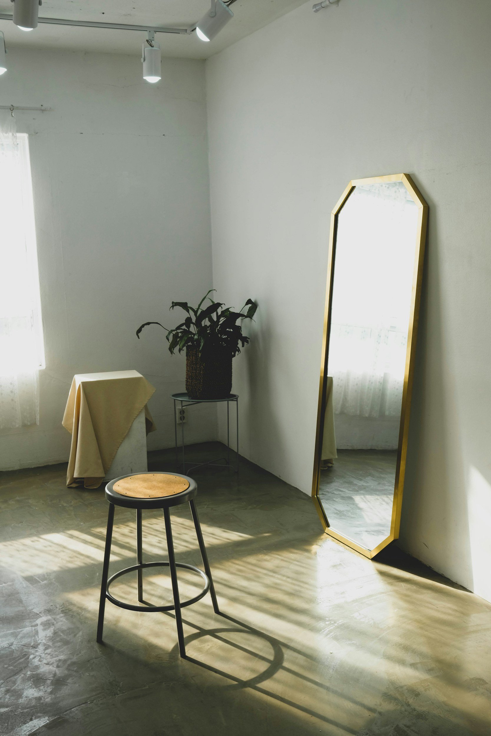 Empty stool in front of a tall mirror, identity and self-reflection after relationship betrayal San Antonio Texas