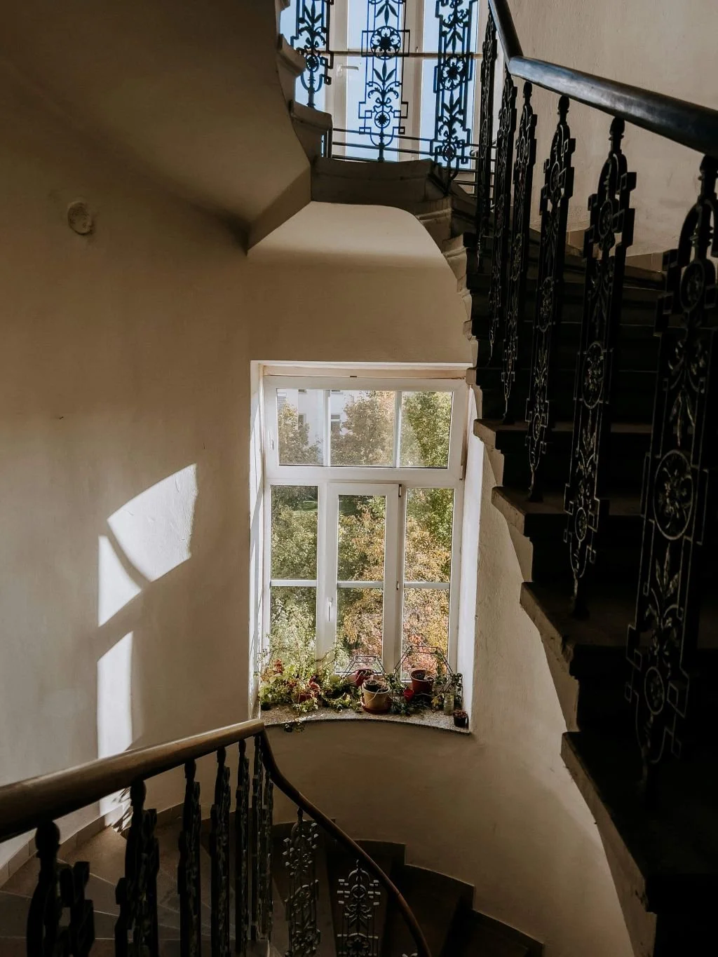 View from above of winding staircase with window light, trauma and PTSD treatment San Antonio Texas