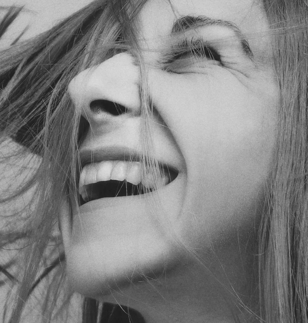 Woman smiling with genuine ease, HSP therapy for women San Antonio Texas