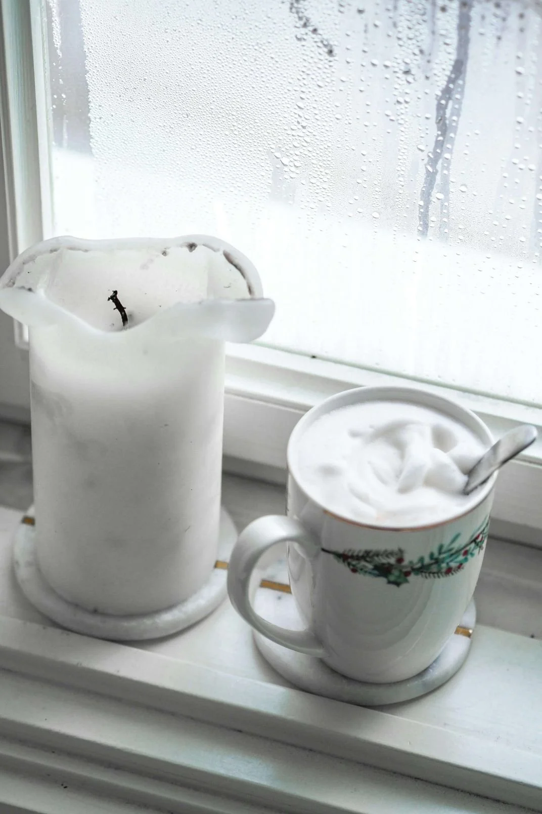 White flower and latte in a mug by a window, online trauma and attachment therapy in Texas by Vita Counseling Center.