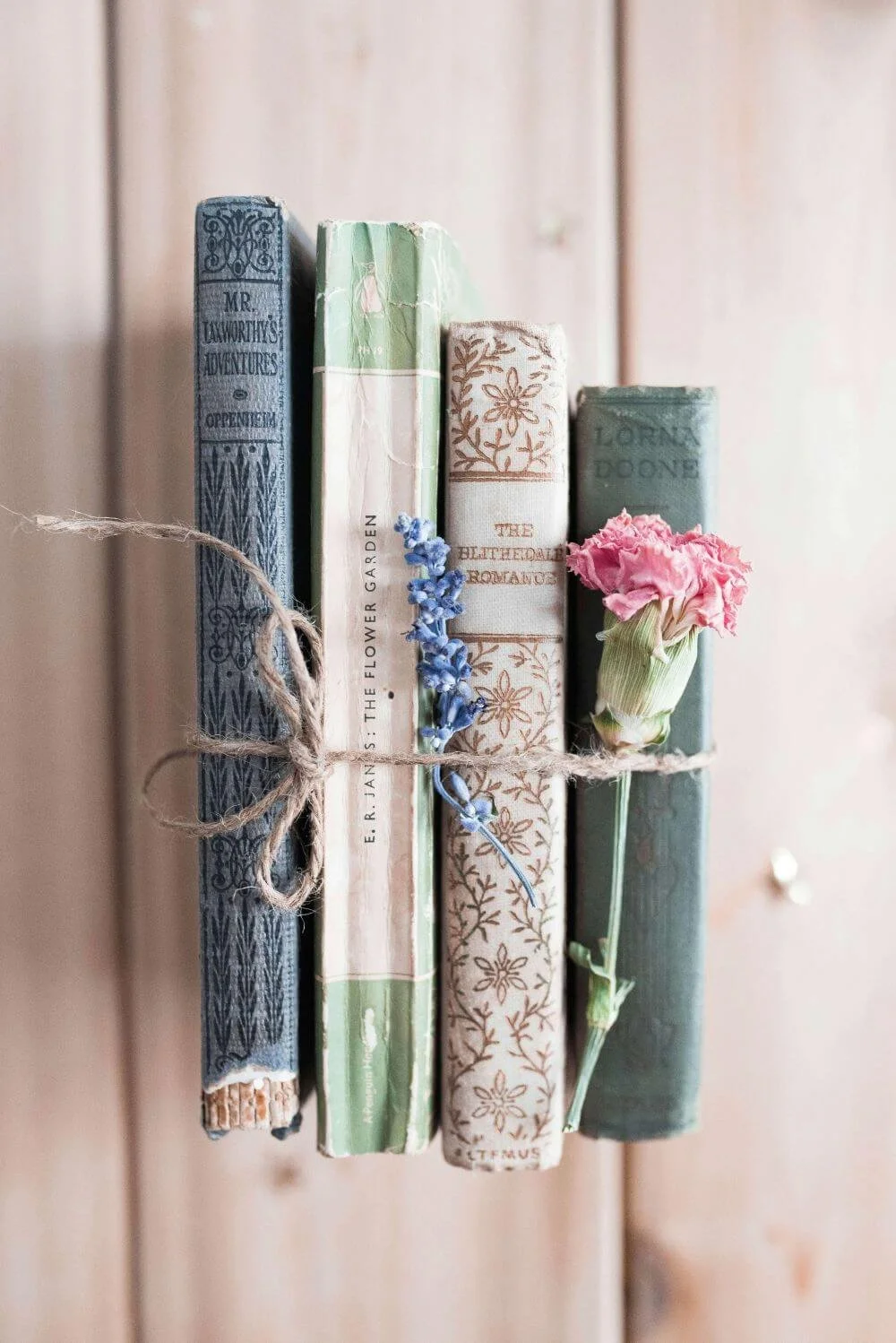 Soft pastel stacked books, contact Rebecca Flores LPC Vita Counseling Center Texas