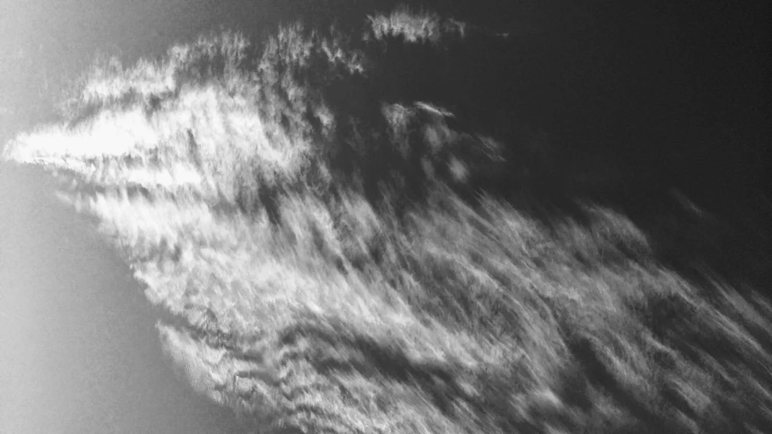 Abstract black and white cloud formation resembling an ultrasound image, pregnancy trauma and reproductive trauma therapy San Antonio Texas