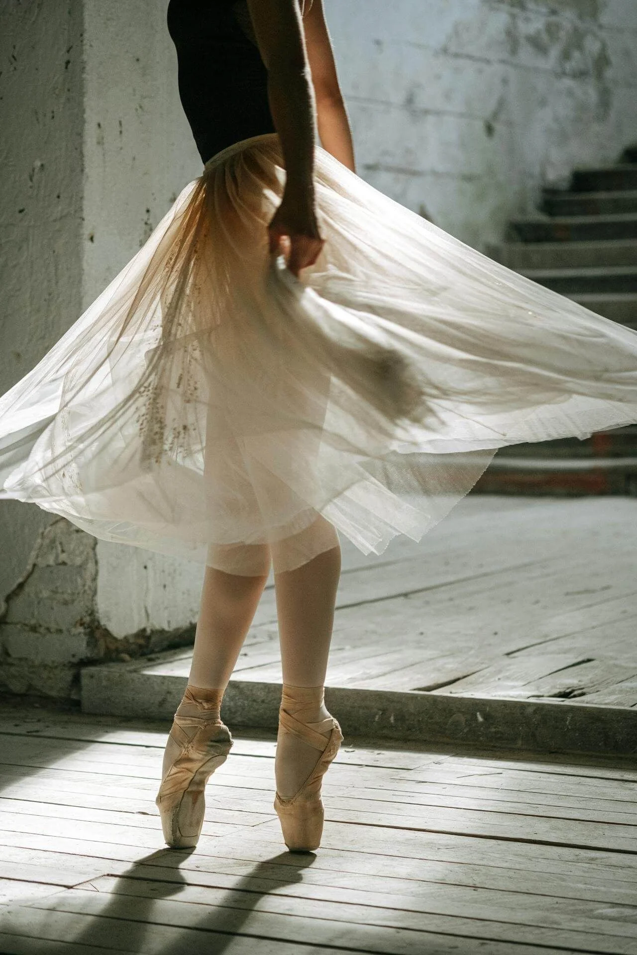 Ballerina en pointe in soft light, anxiety therapy for women exploring the effort beneath the surface San Antonio Texas
