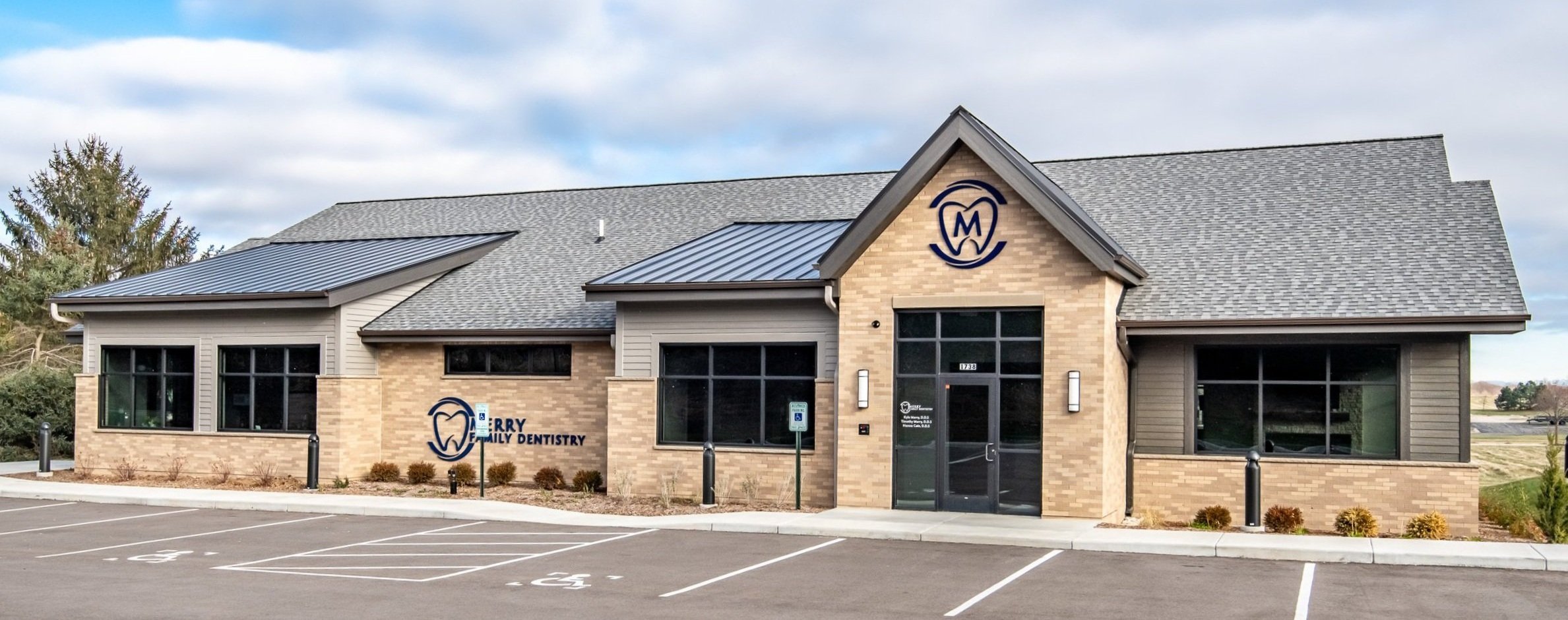 Merry family dentistry new office and brick building and front door