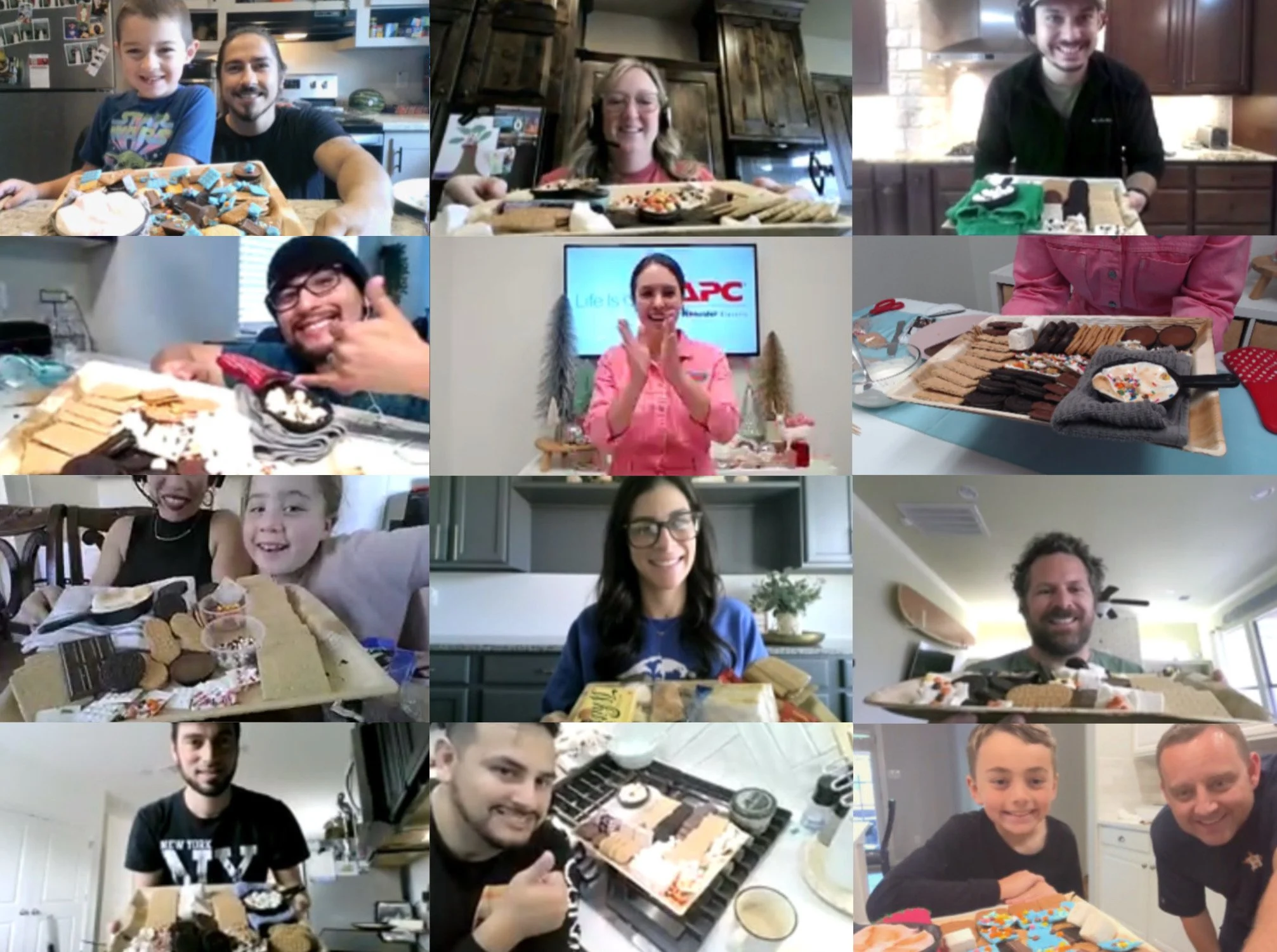 Happy and proud participants show off their s'mores charcuterie boards made during a virtual class in winter 2025. The team building experience is family friendly, and a lot of kid helpers joined the virtual event.