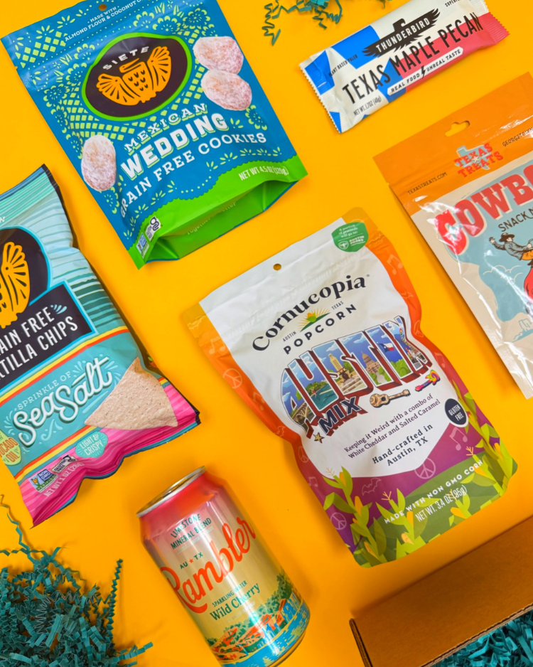 Some items in Keep Austin Snacking, including Siete chips and Mexican wedding cookies, Rambler sparkling water, Cornucopia Austin Mix, Texas Treats Cowboy Snack Mix, and Thunderbird Texas Maple Pecan