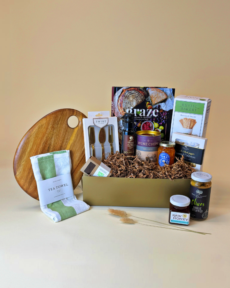 Countryside Graze gift, featuring premium hosting essentials along with gourmet snacks and treats to enjoy with a charcuterie spread.