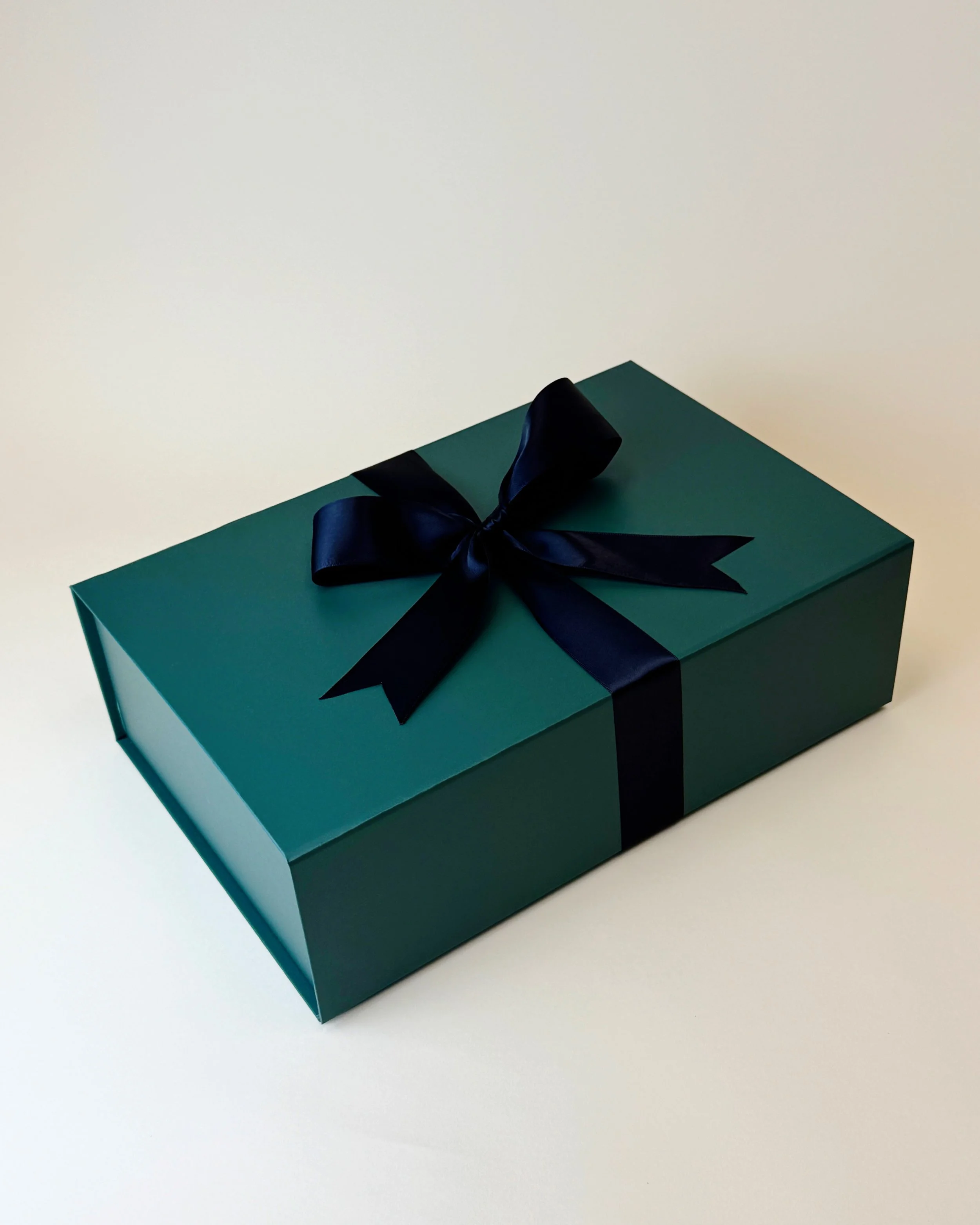 Green Gift box with black ribbon