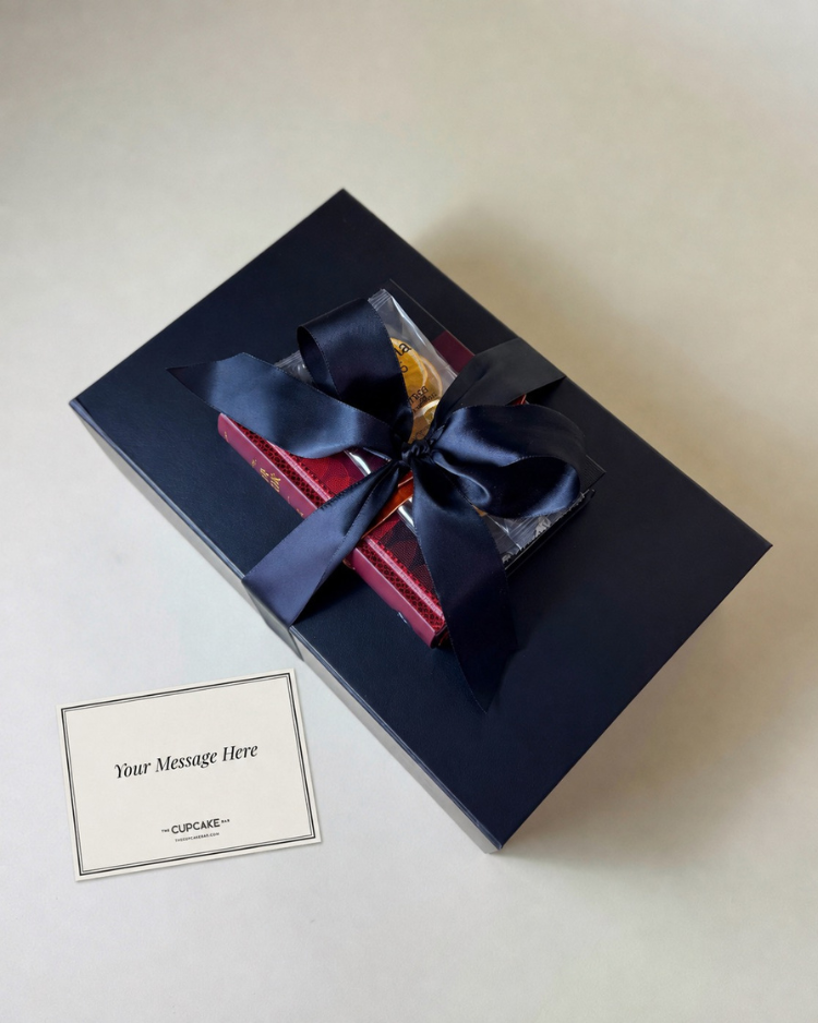Gift box gift wrapped with satin ribbon and handwritten notecard