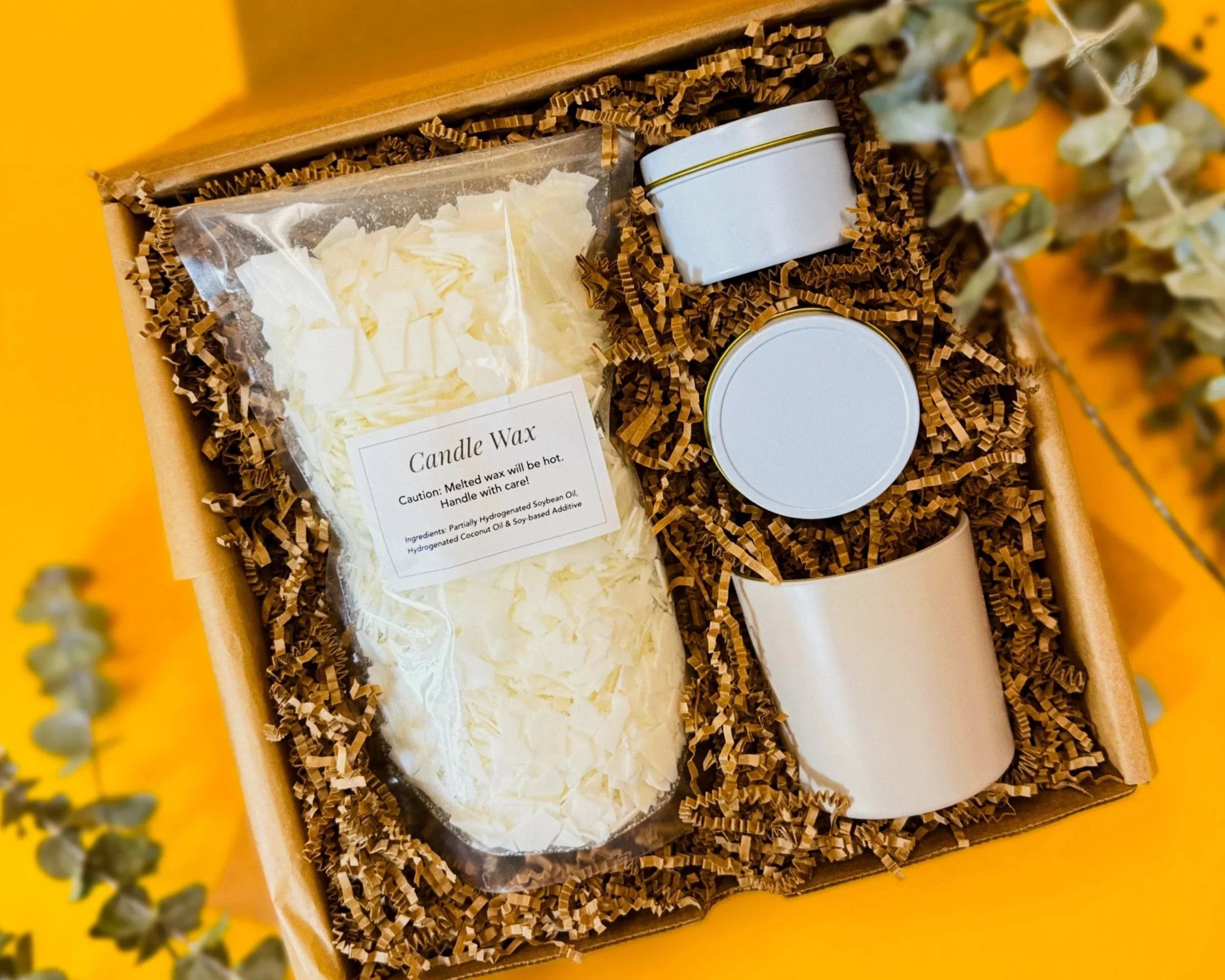 All of the contents of our candle-making kit, including wax, vessels, pouring supplies, instructions, and more!