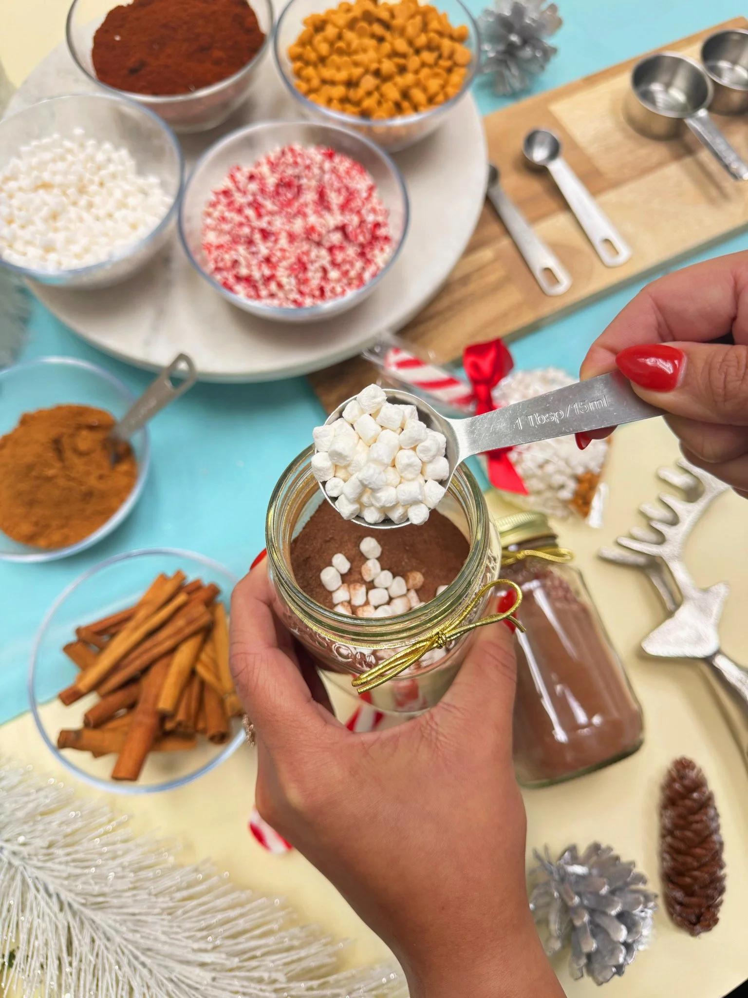 An overhead shot of a guest making their own hot cocoa mix at the hot cocoa mix station