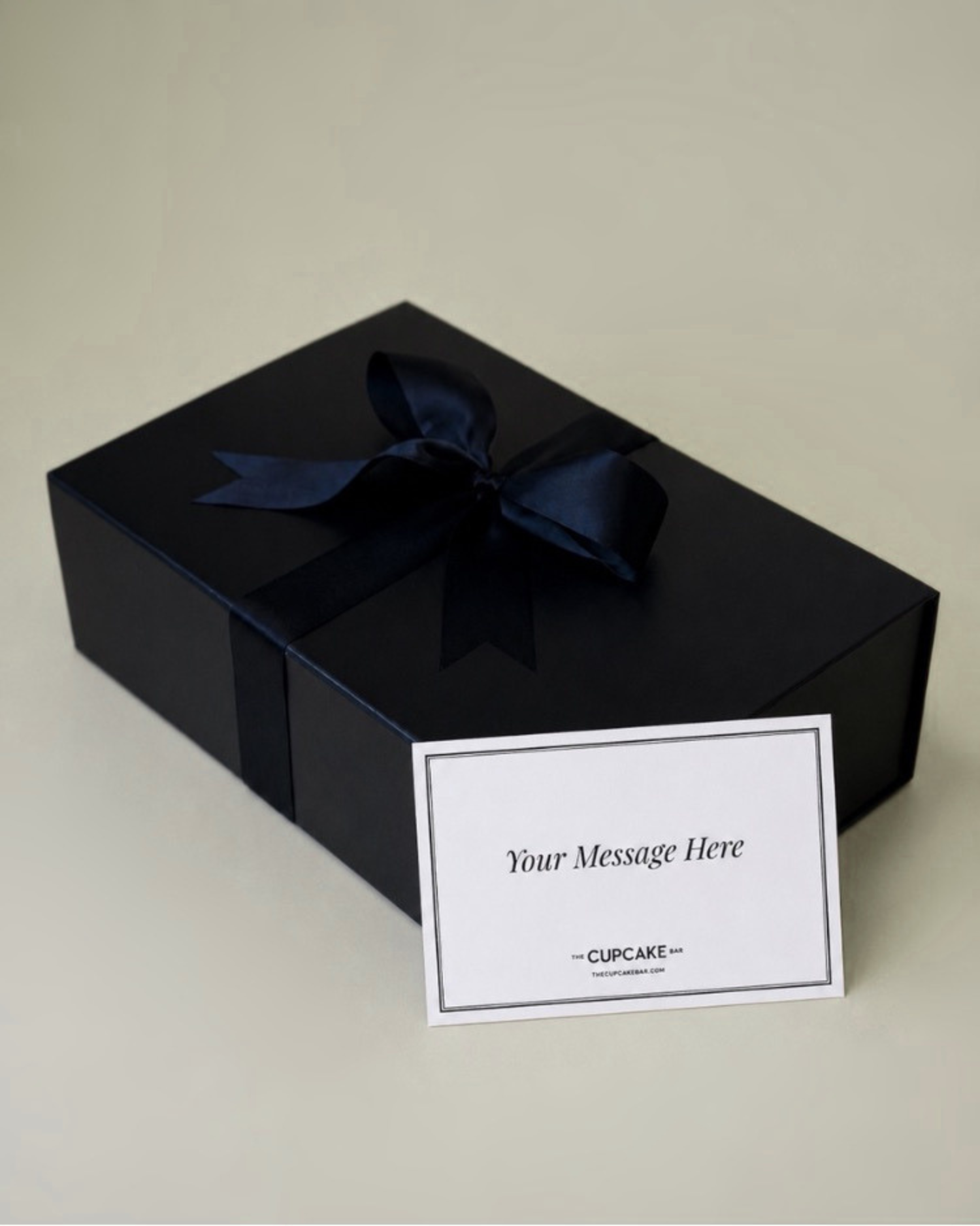 Gift box gift wrapped with satin ribbon and handwritten notecard (Copy)