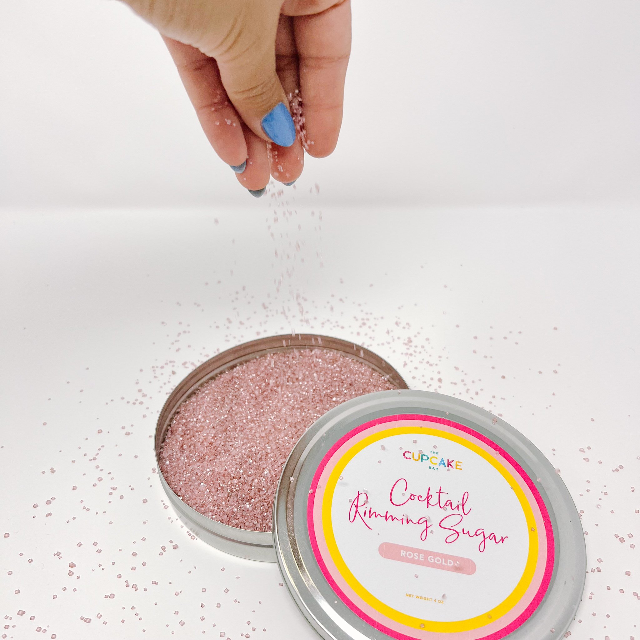 Rose Gold Cocktail Rimming Sugar being sprinkled