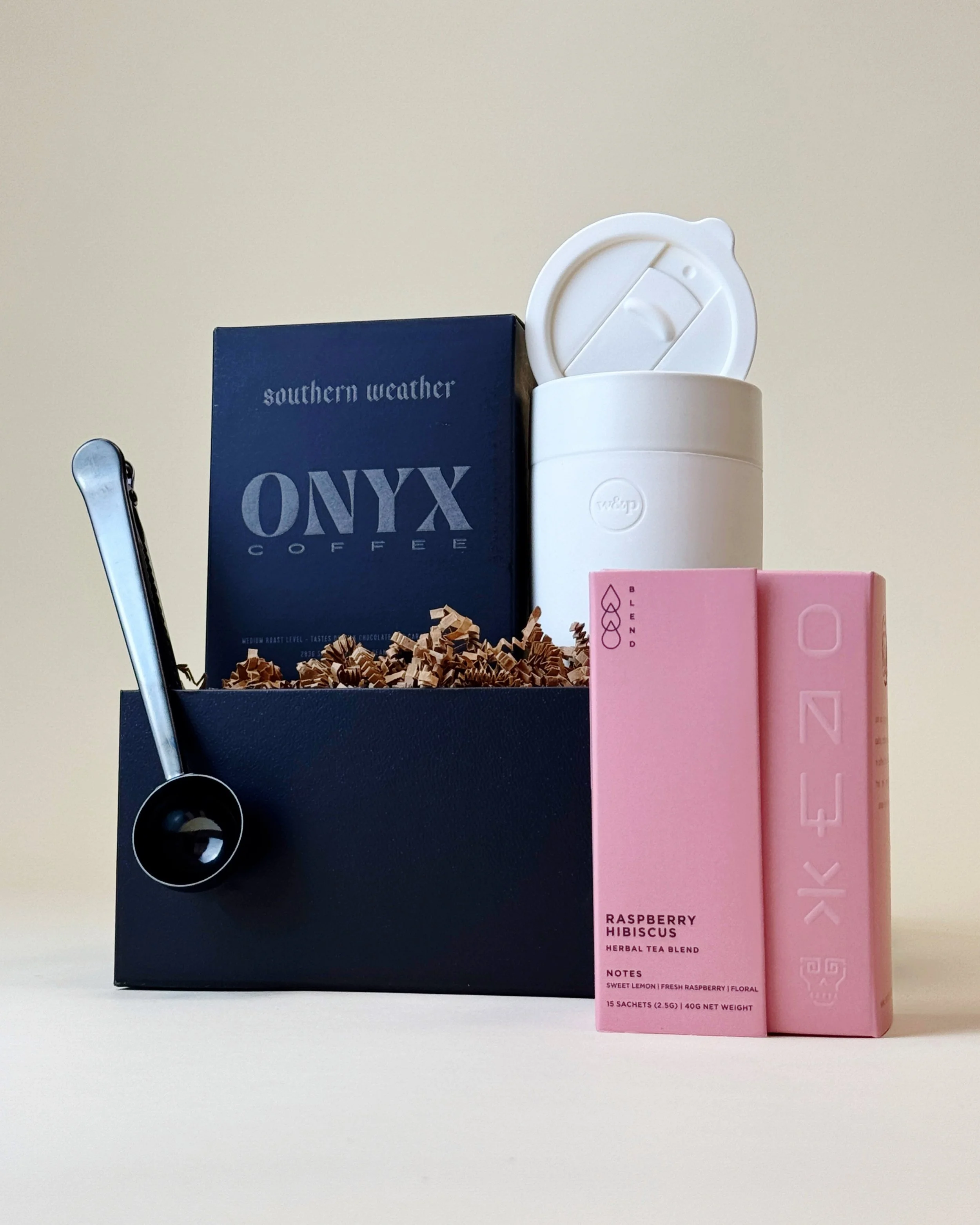 Luxury coffee and tea gift box featuring ONYX Coffee and tea, white travel tumbler, and a coffee scoop/bag clip, titled The Collector’s Brew. (Copy)