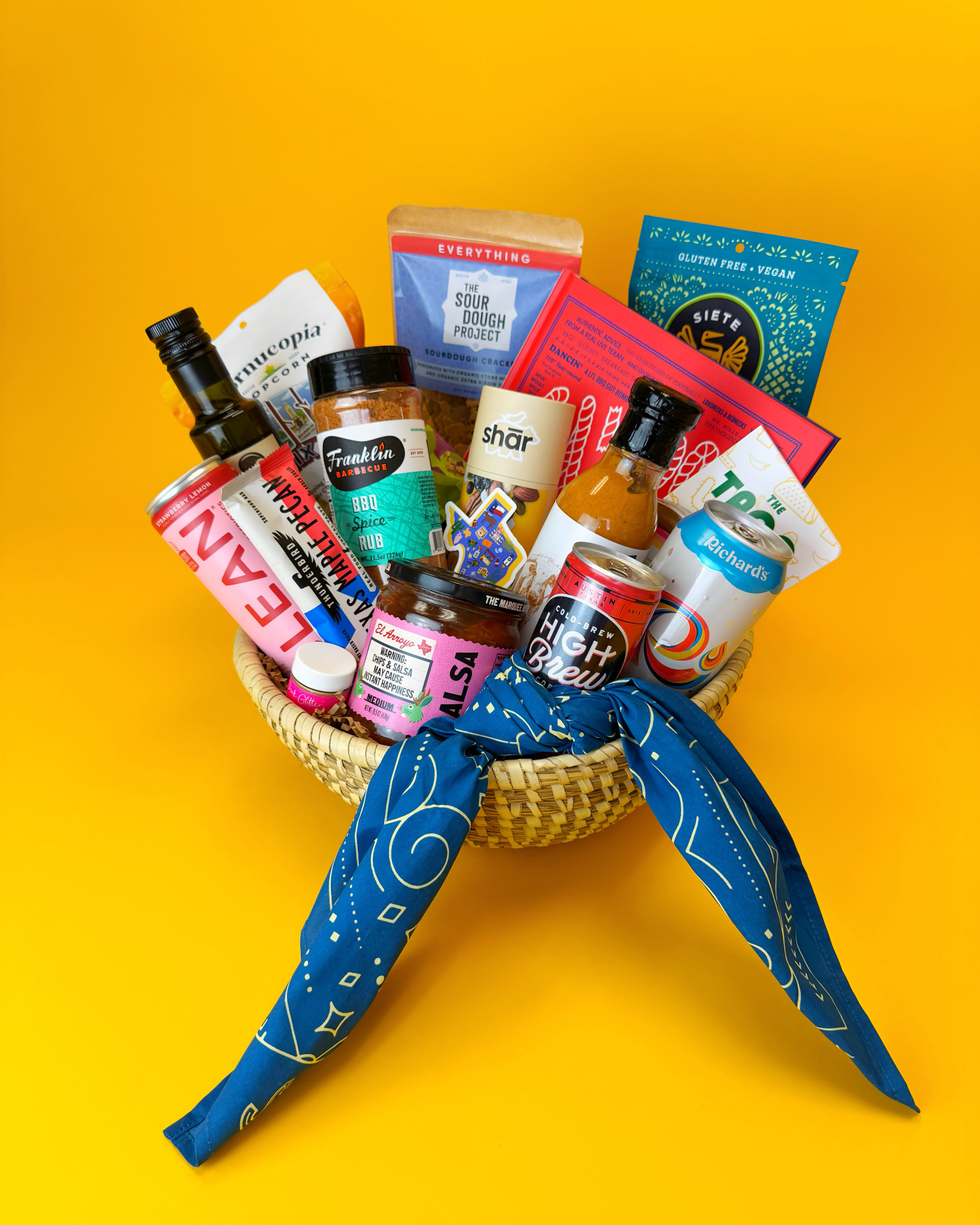 Gift basket filled to the brim with Austin goodies representing the diverse flavors of the city. Thoughtfully packaged. Beautifully arranged.