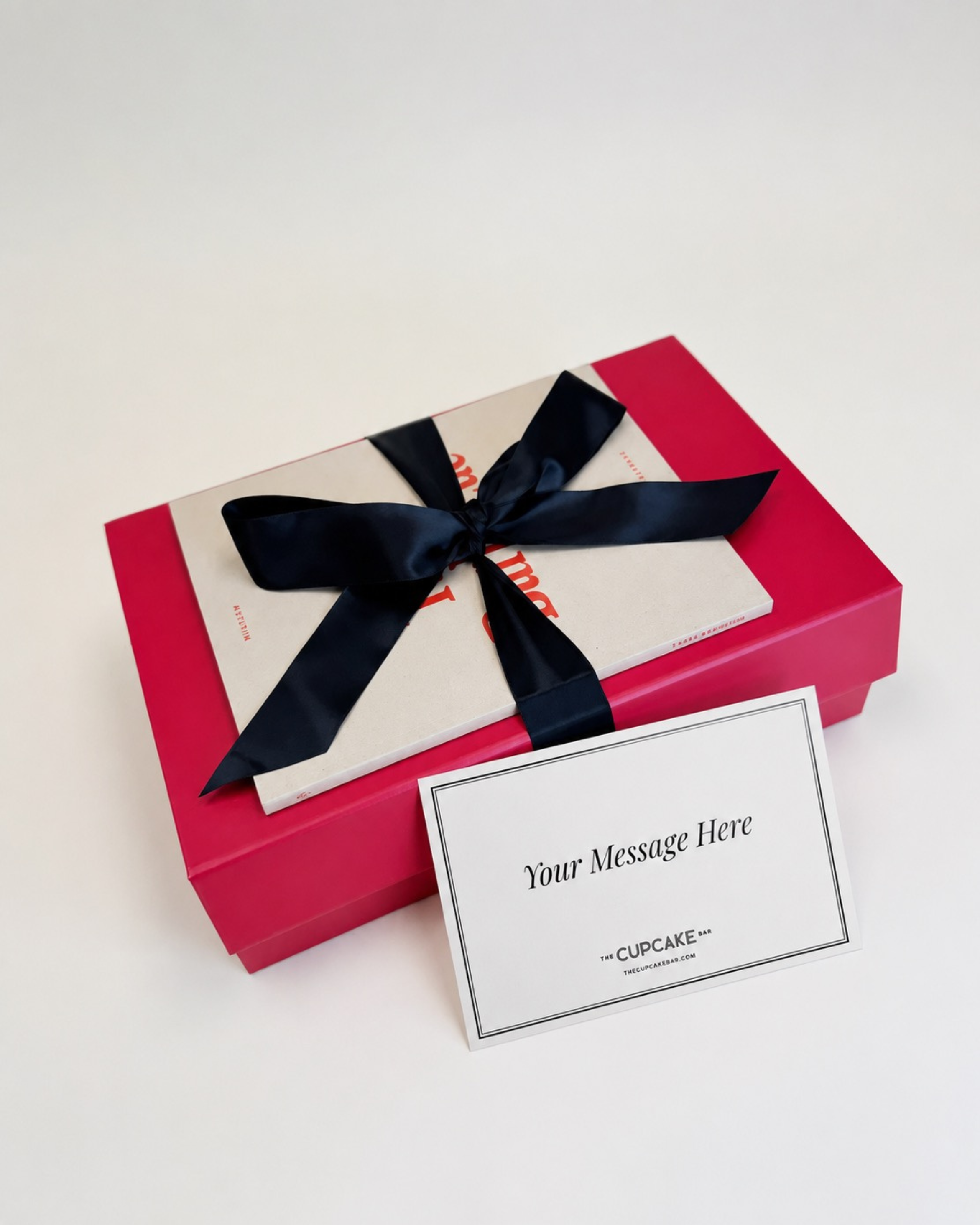 Sleek and presentable gift box packaging, featuring a luxurious magnetic flap gift box and a perfectly tied black satin bow. Handwritten notecard included off to the side.