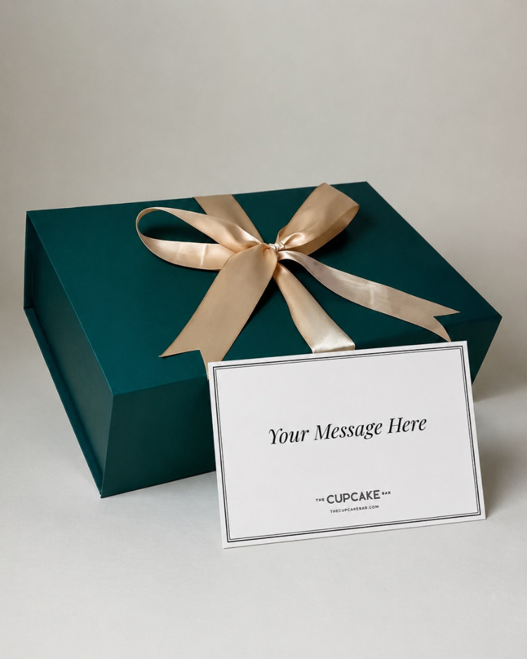 Green magnetic-closure gift box with satin ribbon and handwritten notecard