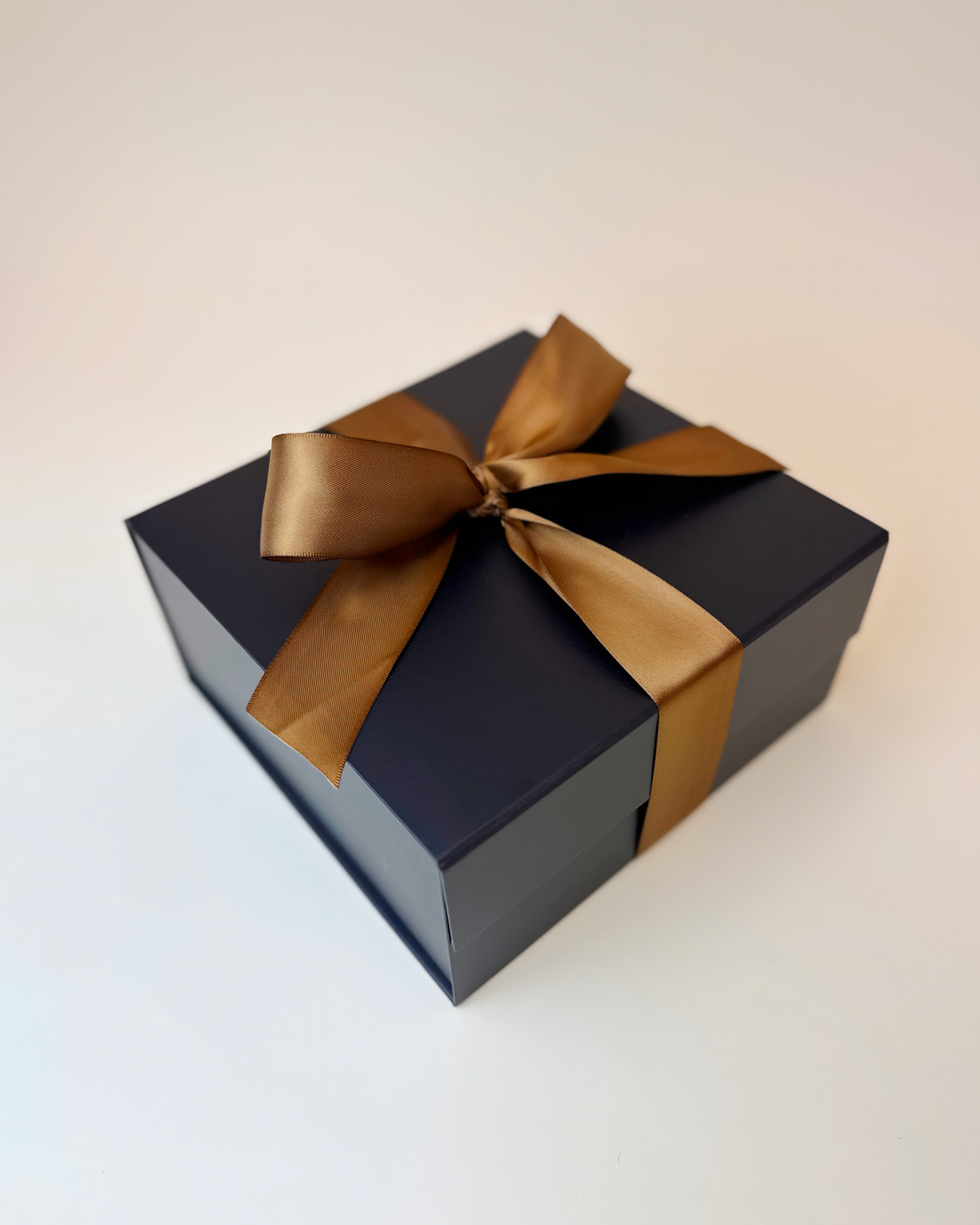 Sleek and presentable gift box packaging, featuring a luxurious magnetic flap gift box and a perfectly tied bow