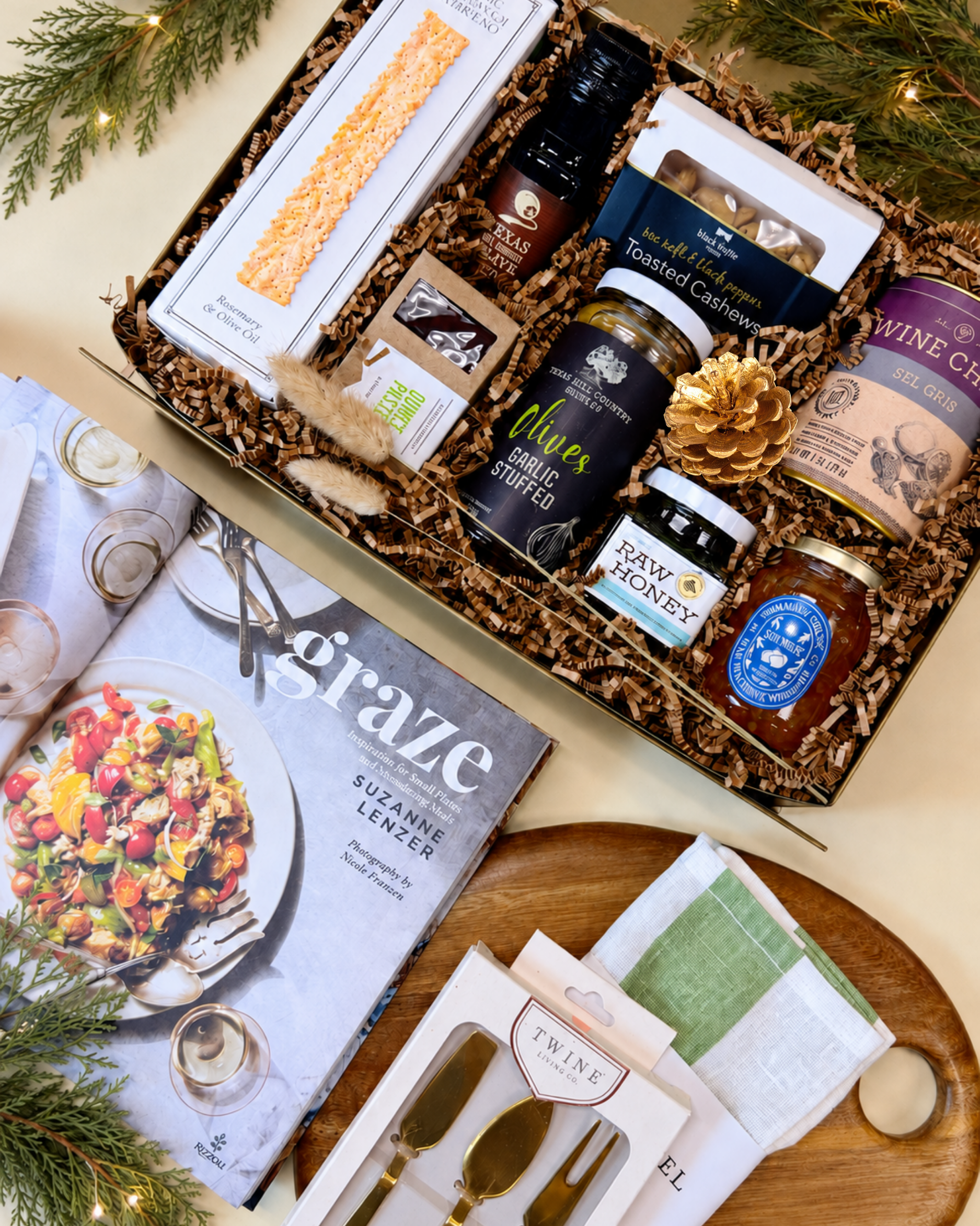 A close up view of the contents of In Good Taste, featuring premium hosting essentials along with gourmet snacks and treats to enjoy with a charcuterie spread. (Copy)