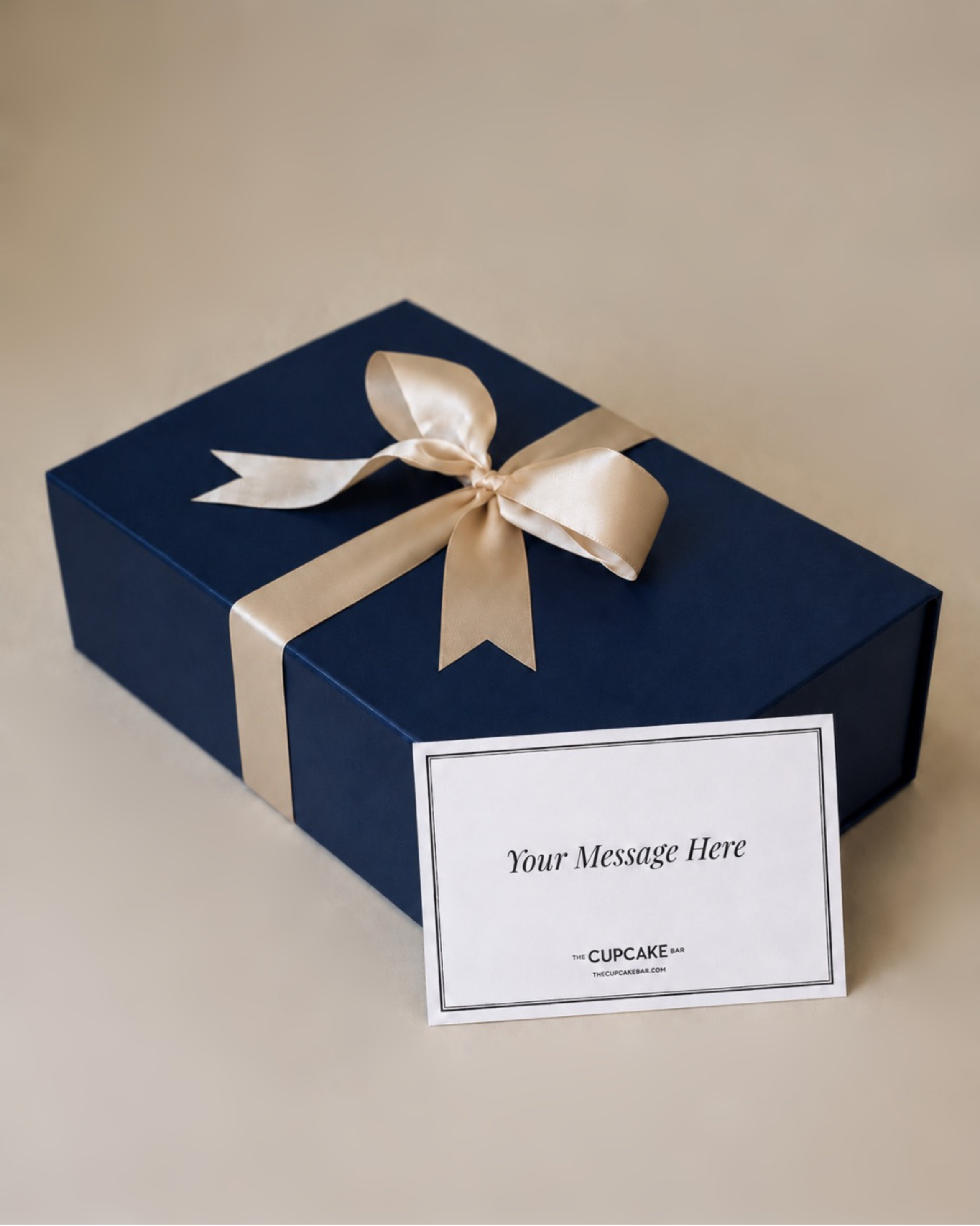 Gift box with satin ribbon and handwritten notecard