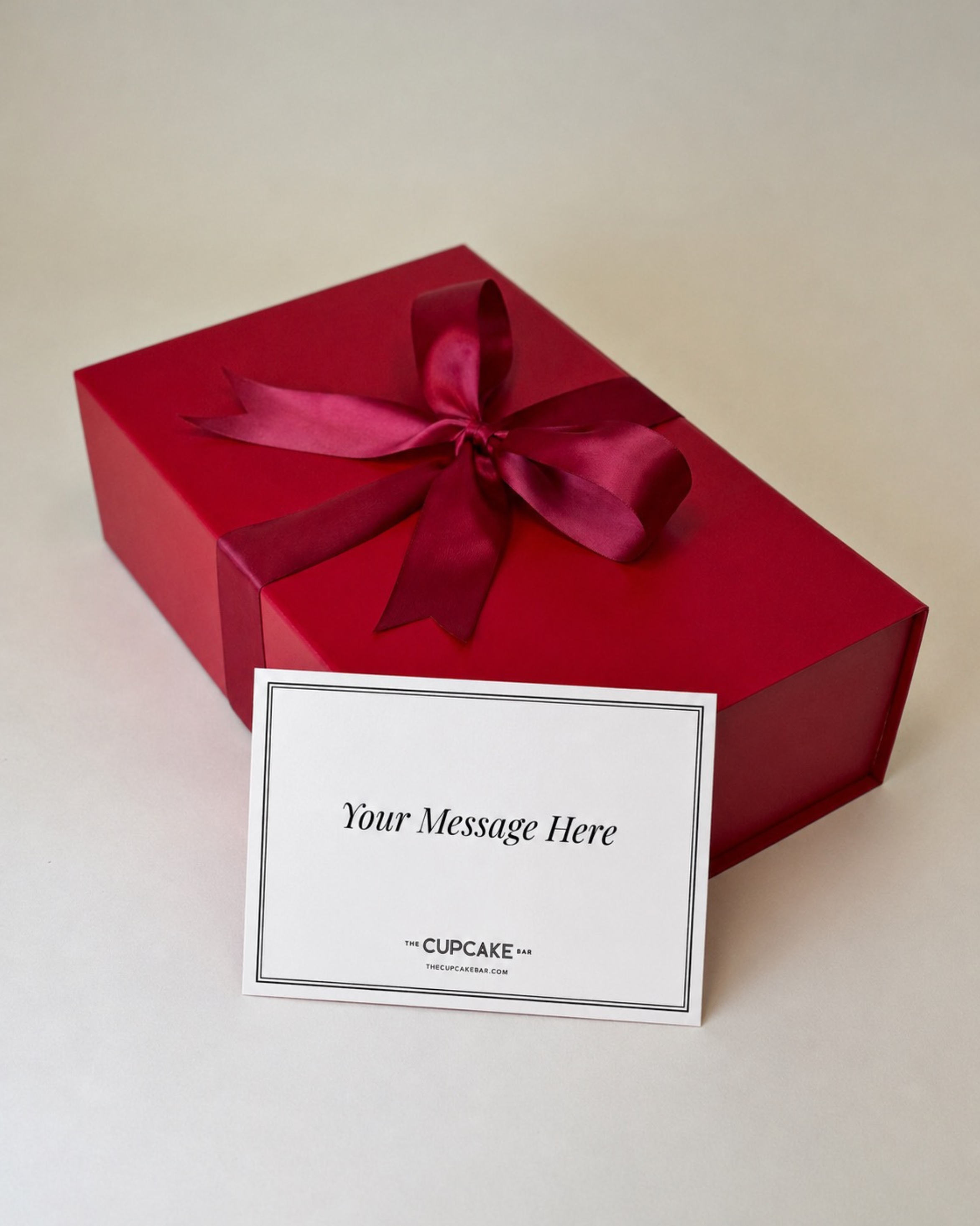 Premium red gift box, gift wrapped with red satin ribbon and handwritten notecard