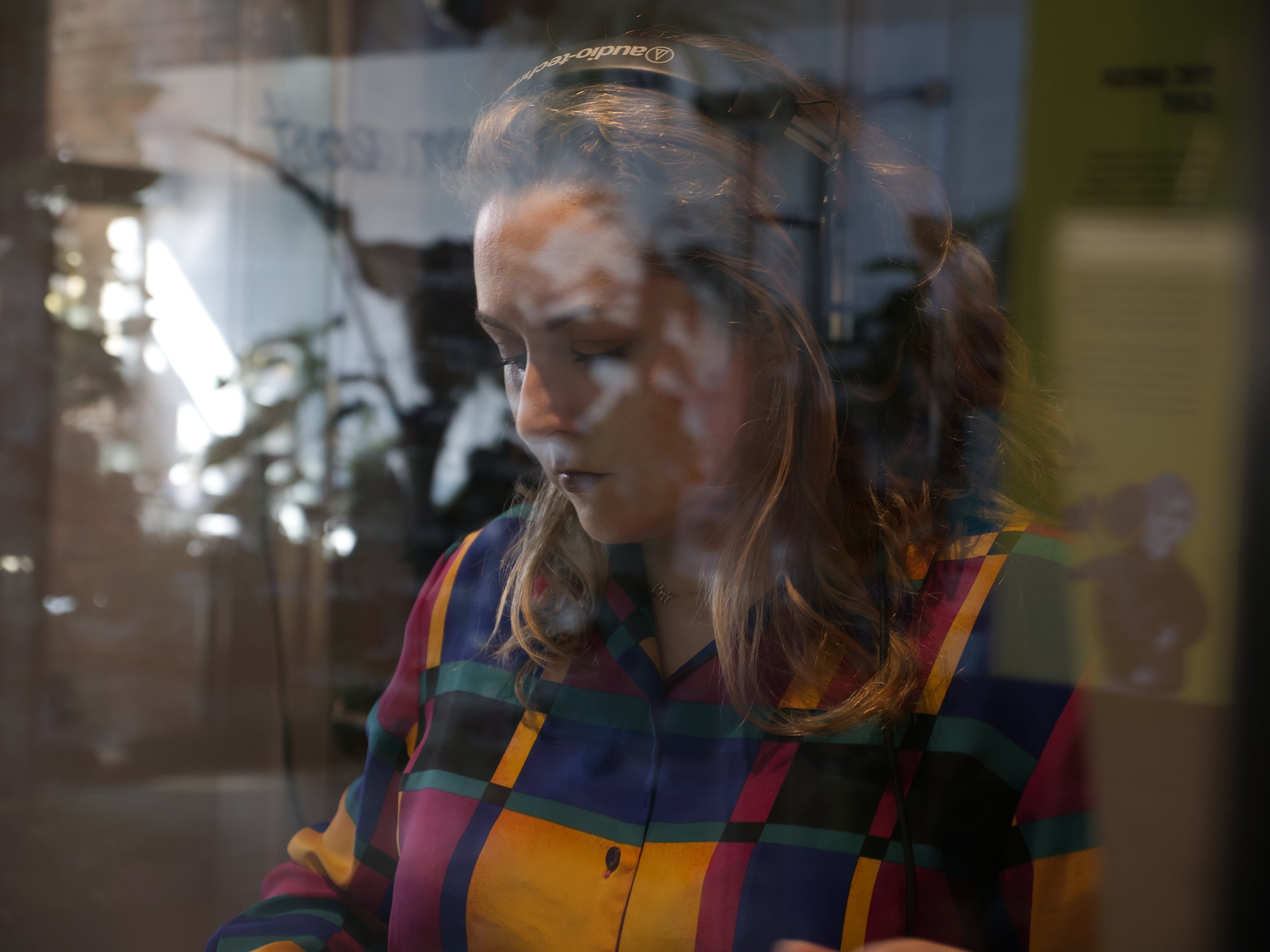 Image of Morgan Blain-Crehan, co-founder of The Spinners Mill Studio playing vinyl records in the studio.