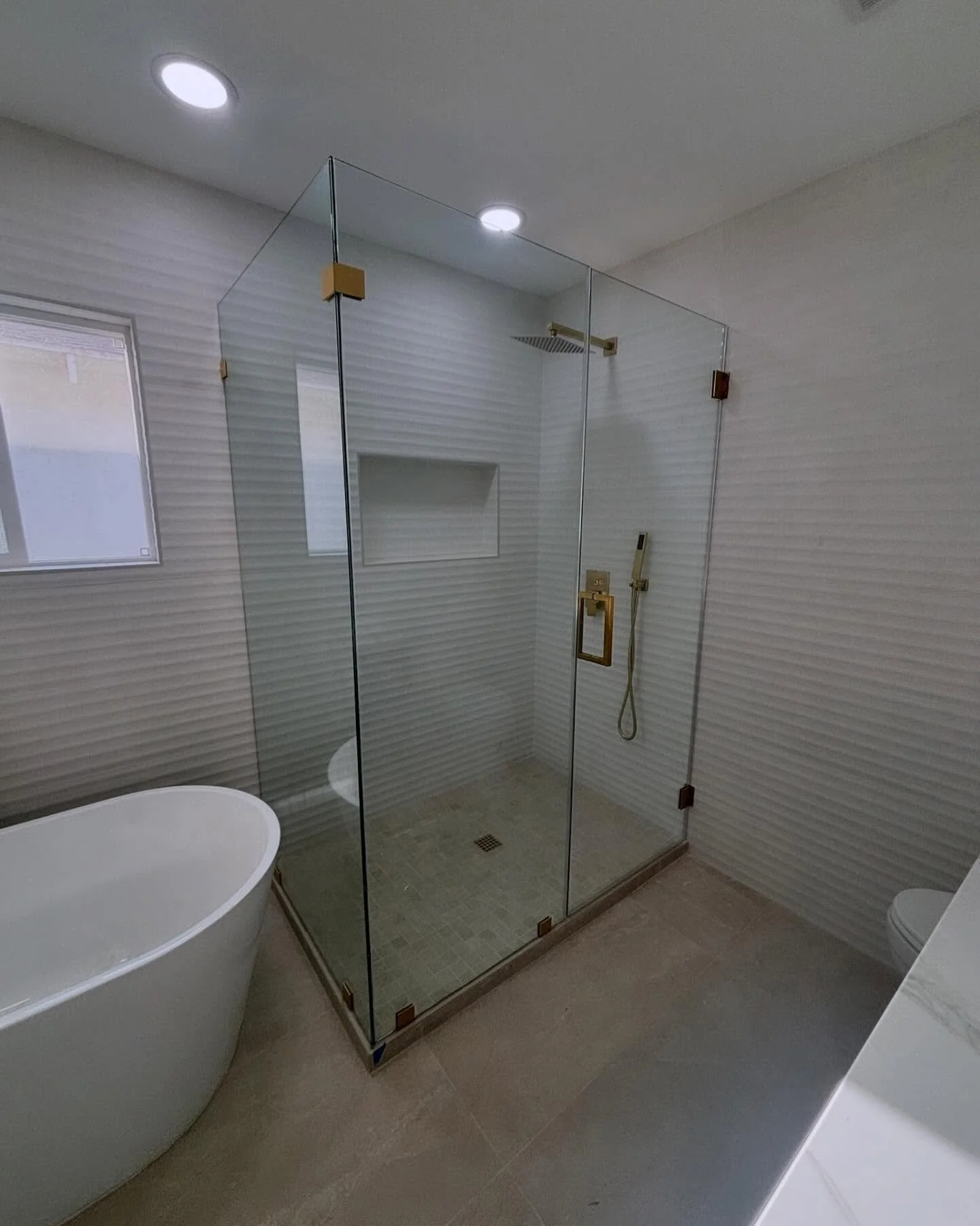 A beautiful 90 degree unit with Satin Brass Hardware. This is made with 3/8&rdquo; Clear Glass.